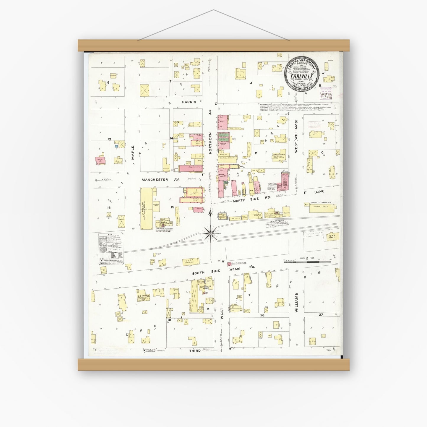 Historic Sanborn map print displayed in a magnetic wood poster frame on a white wall