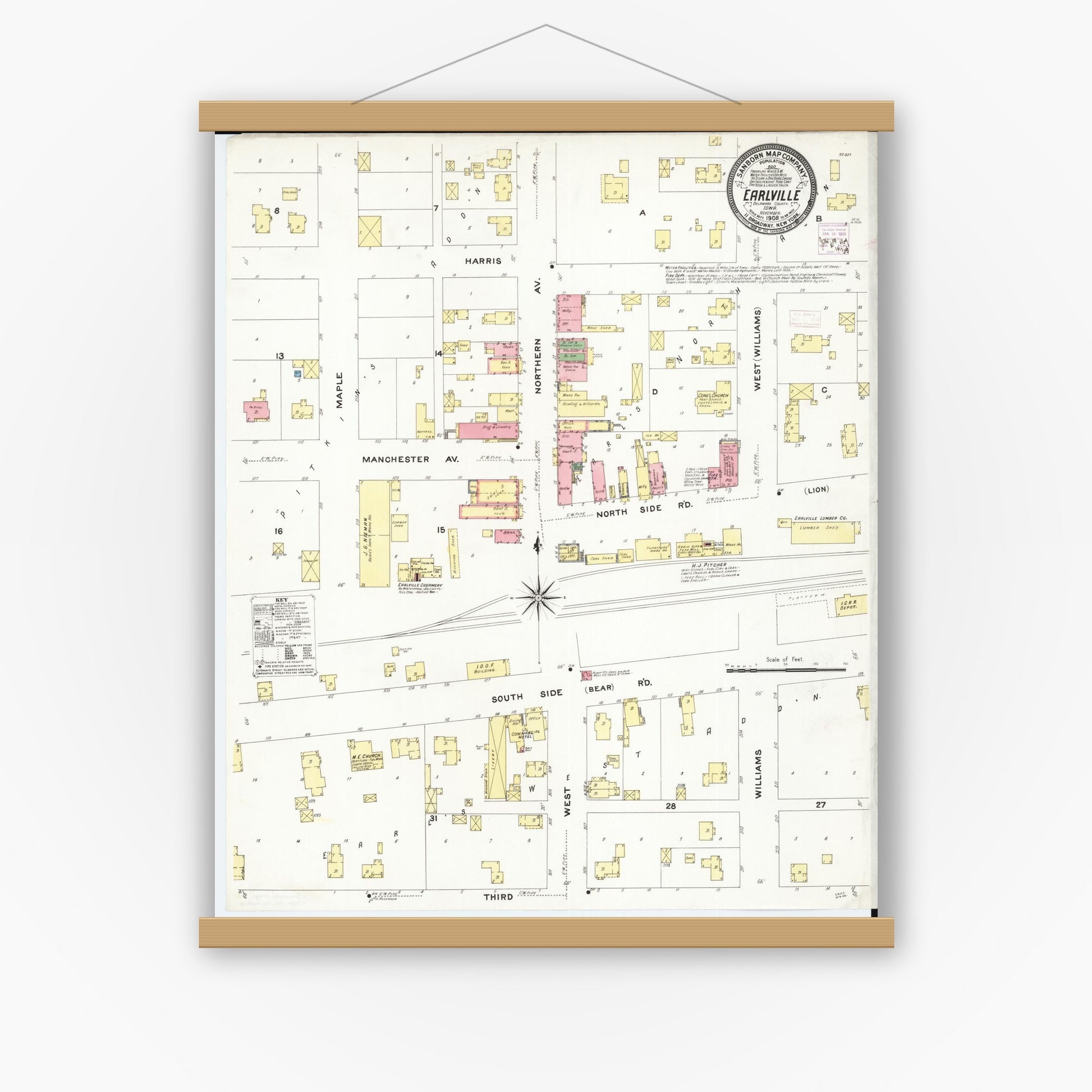 Historic Sanborn map print displayed in a magnetic wood poster frame on a white wall
