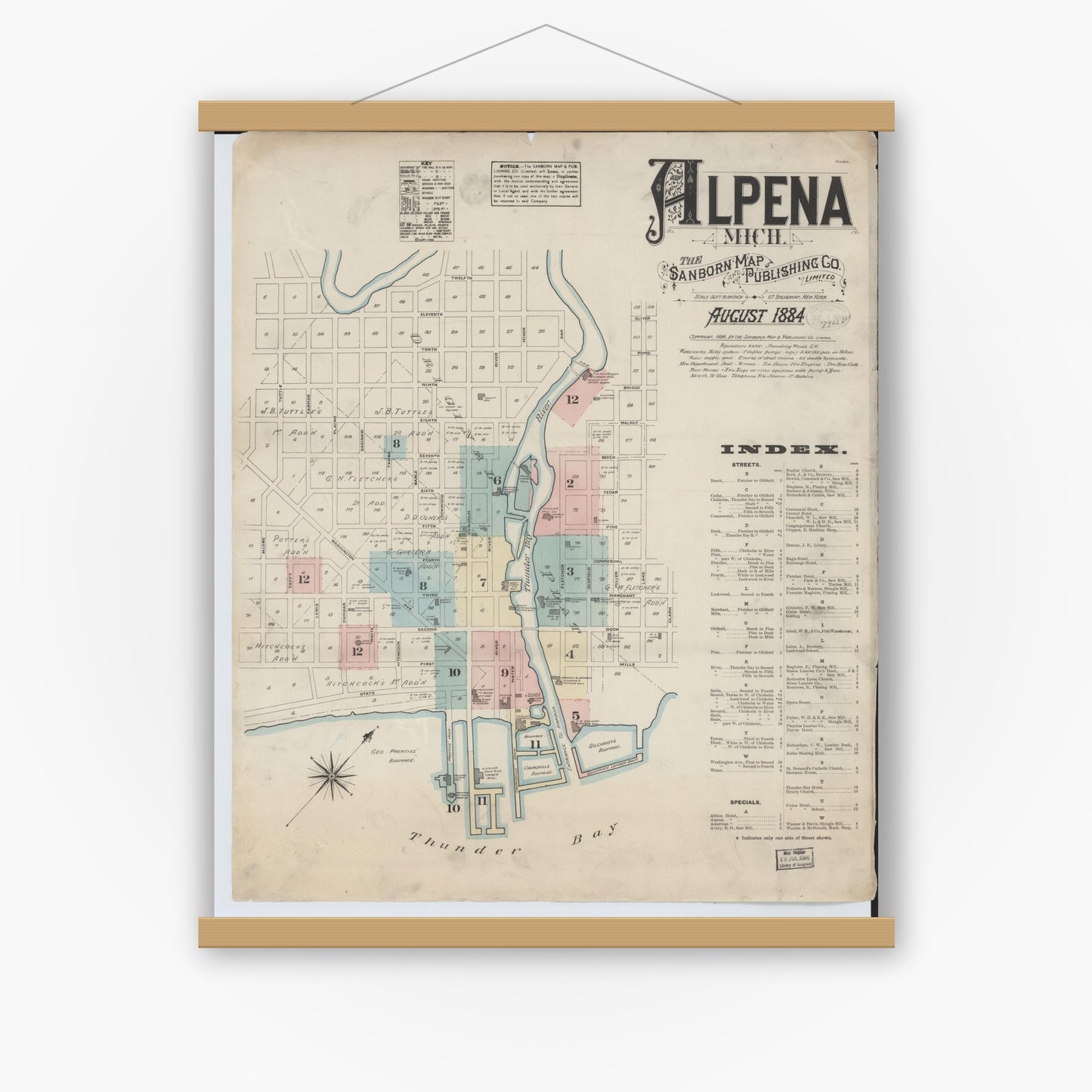 Old map wall art mockup — magnetic wood frame on white wall — Sanborn Fire Insurance Map from Alpena, Alpena County, Michigan (1884), Sheet #0001