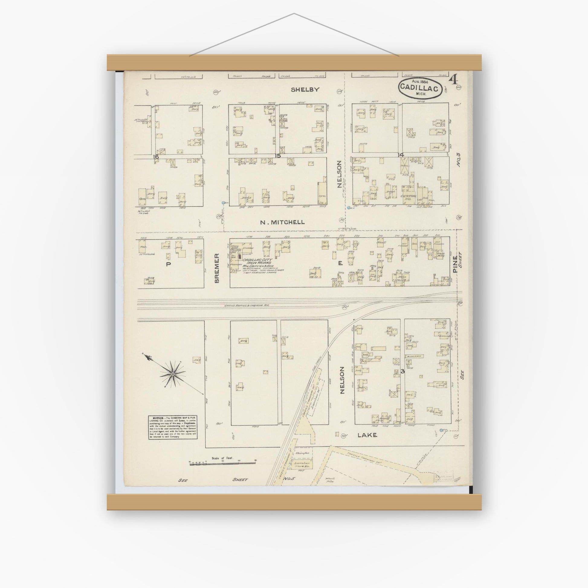 Old map wall art mockup — magnetic wood frame on white wall — Sanborn Fire Insurance Map from Cadillac, Wexford County, Michigan (1884), Sheet #0004