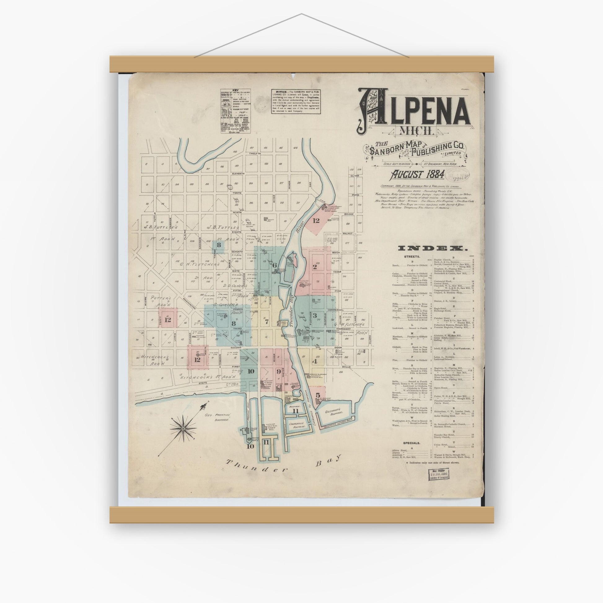 Old map wall art mockup — magnetic wood frame on white wall — Sanborn Fire Insurance Map from Alpena, Alpena County, Michigan (1884) - Complete Map Set