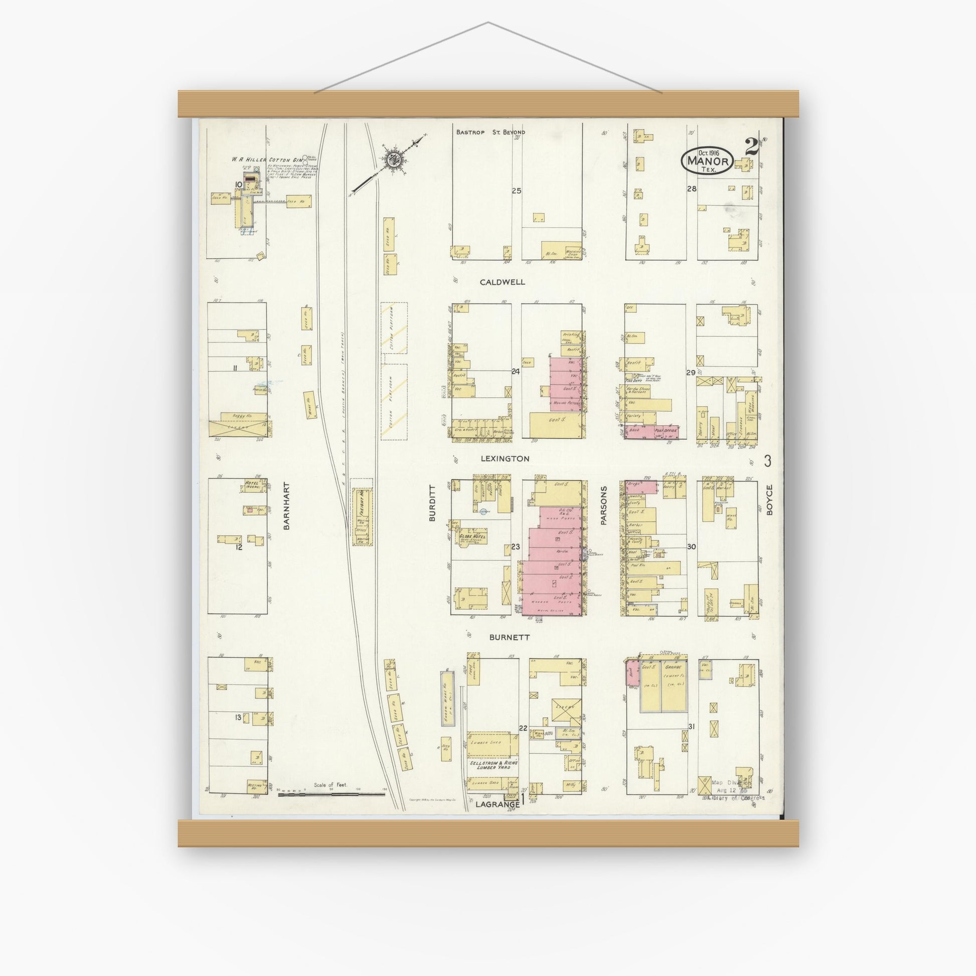 Old map wall art mockup — magnetic wood frame on white wall — Sanborn Fire Insurance Map from Manor, Travis County, Texas (1916), Sheet #0002