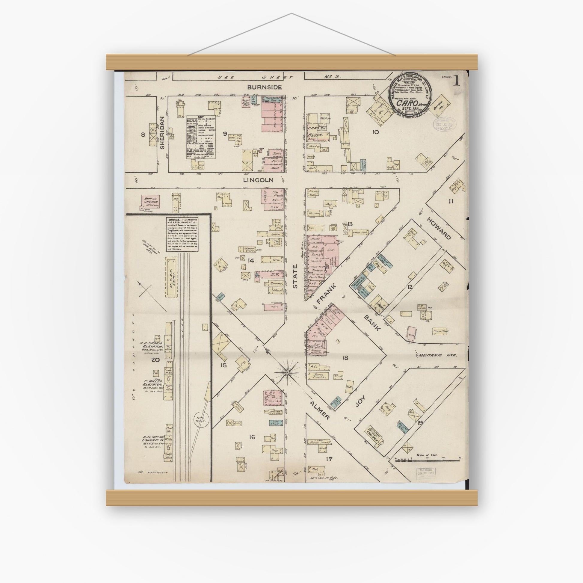 Old map wall art mockup — magnetic wood frame on white wall — Sanborn Fire Insurance Map from Caro, Tuscola County, Michigan (1884) - Complete Map Set