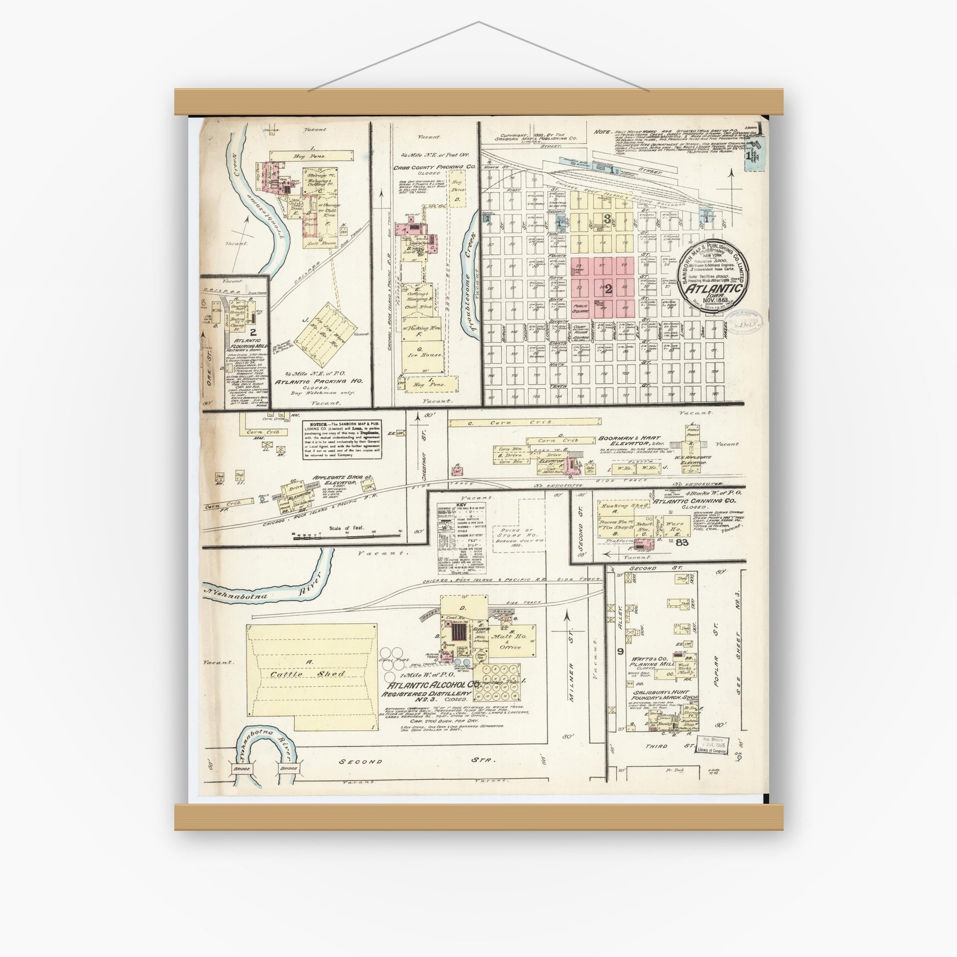 Old map wall art mockup — magnetic wood frame on white wall — Sanborn Fire Insurance Map from Atlantic, Cass County, Iowa (1883) â€” Complete Set