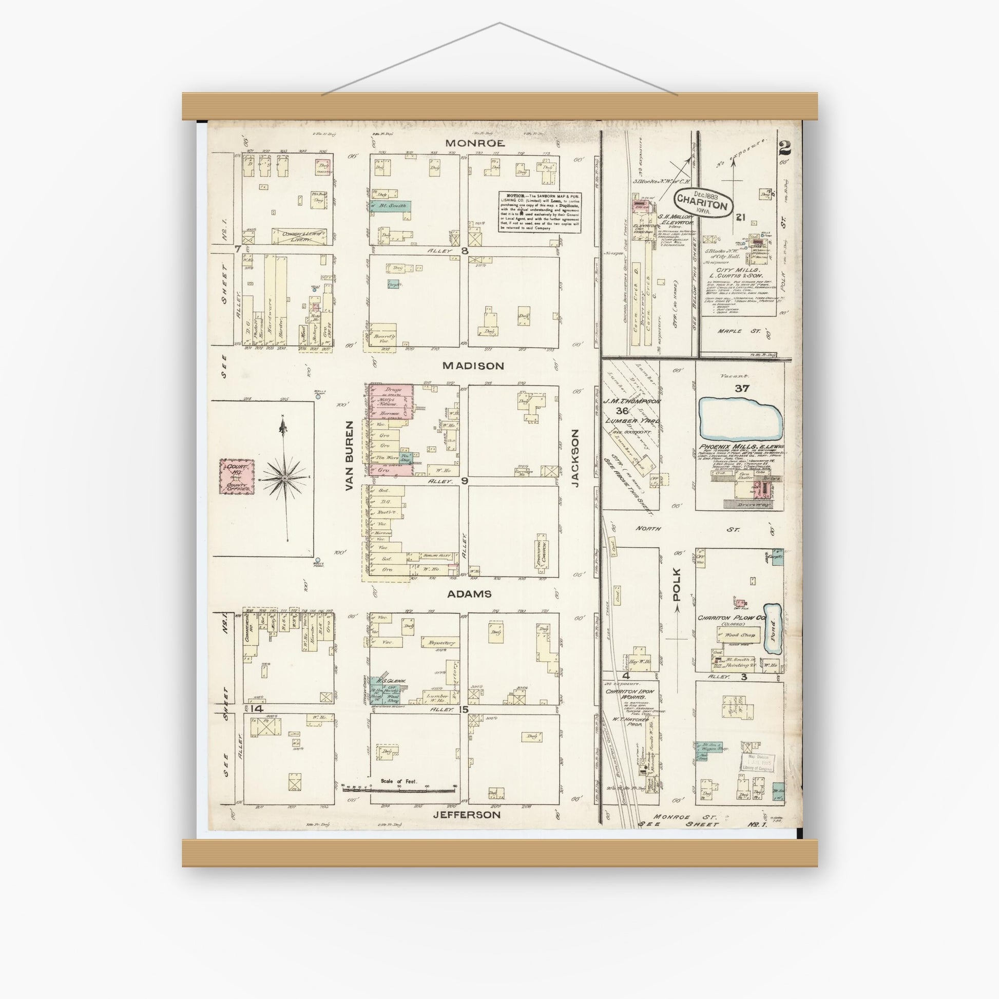 Old map wall art mockup — magnetic wood frame on white wall — Sanborn Fire Insurance Map from Chariton, Lucas County, Iowa (1883), Sheet #0002