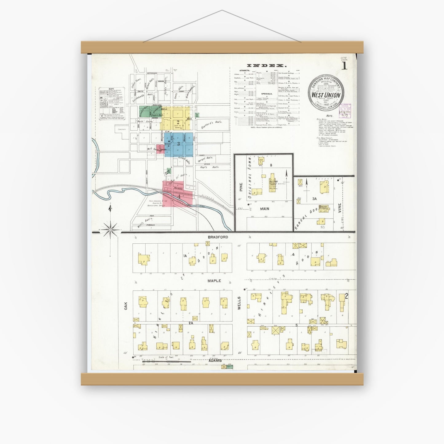 Old map wall art mockup — magnetic wood frame on white wall — Sanborn Fire Insurance Map from West Union, Fayette County, Iowa (1902), Sheet #0001