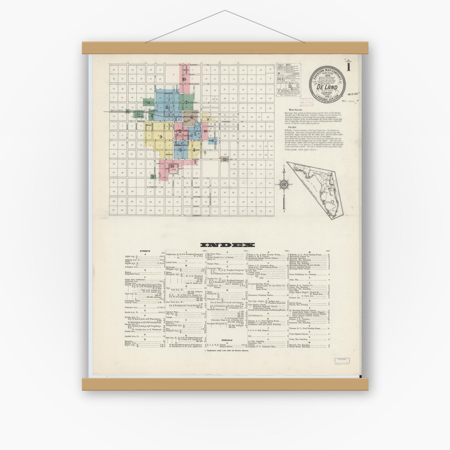 Old map wall art mockup — magnetic wood frame on white wall — Sanborn Fire Insurance Map from De Land, Volusia County, Florida (1915) - Complete Map Set