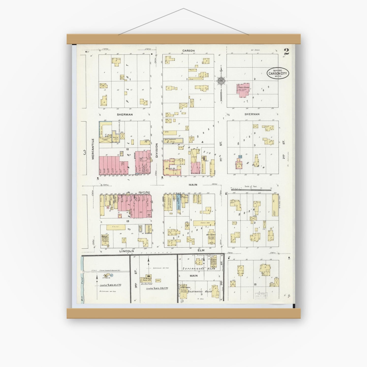 Old map wall art mockup — magnetic wood frame on white wall — Sanborn Fire Insurance Map from Carson City, Montcalm County, Michigan (1910), Sheet #0002