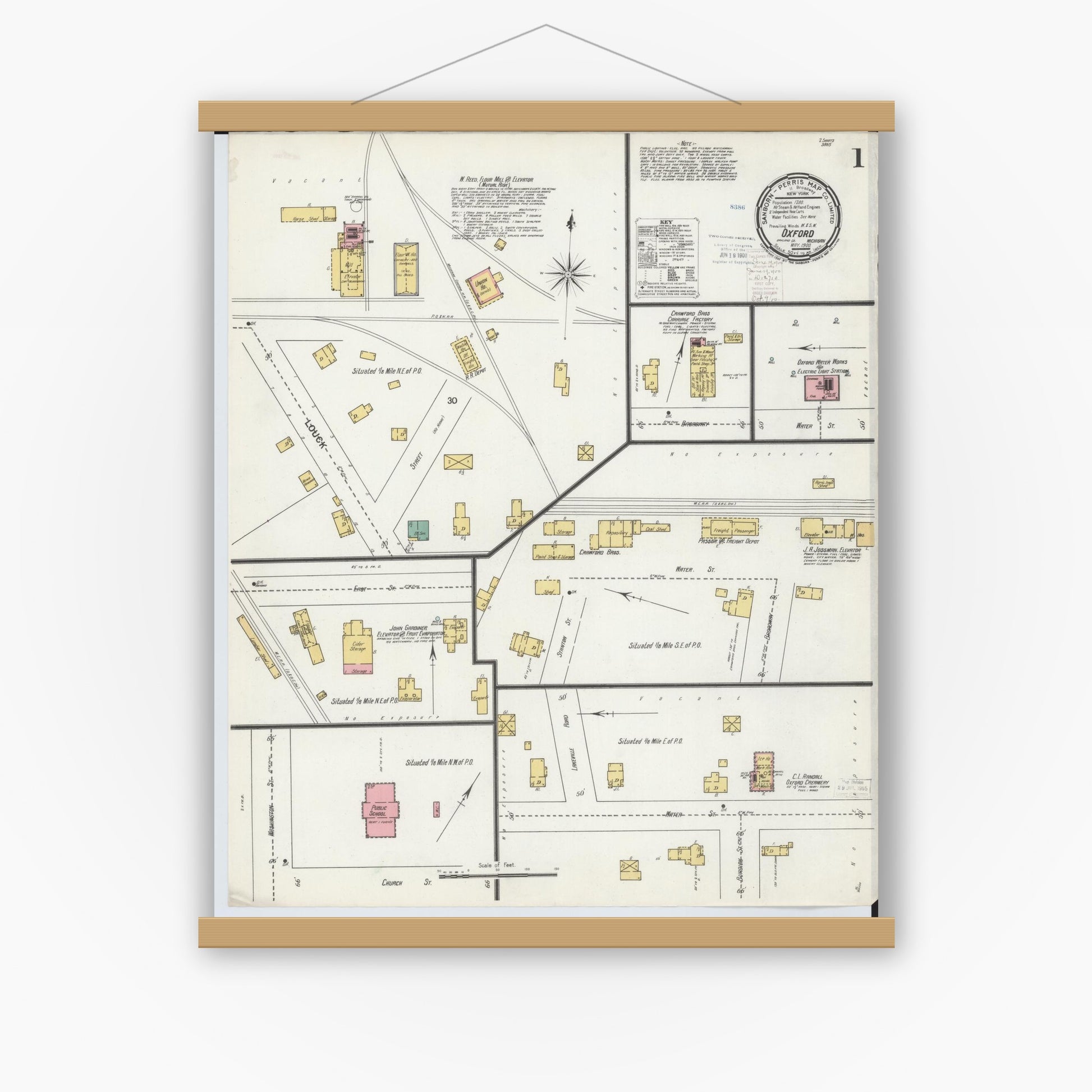 Old map wall art mockup — magnetic wood frame on white wall — Sanborn Fire Insurance Map from Oxford, Oakland County, Michigan (1900) - Complete Map Set