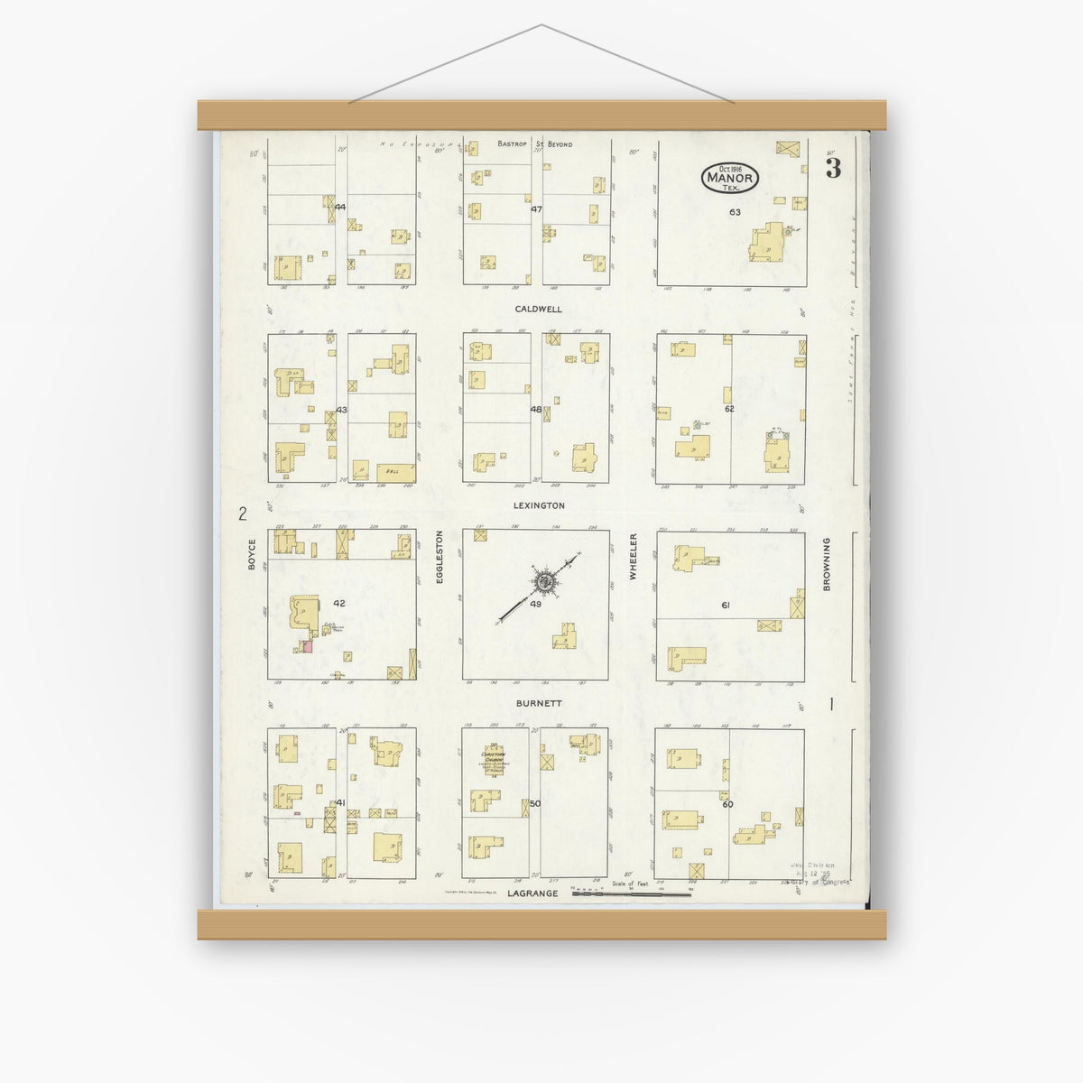 Old map wall art mockup — magnetic wood frame on white wall — Sanborn Fire Insurance Map from Manor, Travis County, Texas (1916), Sheet #0003