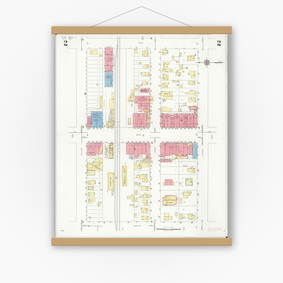 Old map wall art mockup — magnetic wood frame on white wall — Sanborn Fire Insurance Map from Ovid, Clinton County, Michigan (1934), Sheet #0002