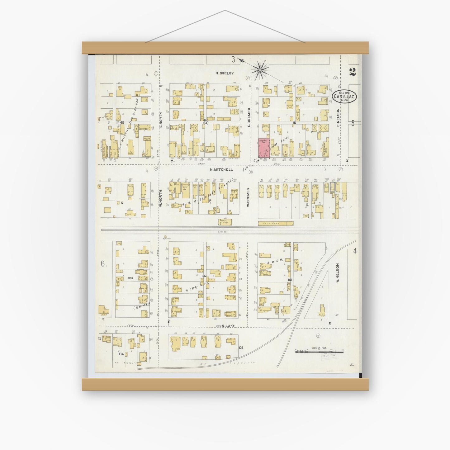 Old map wall art mockup — magnetic wood frame on white wall — Sanborn Fire Insurance Map from Cadillac, Wexford County, Michigan (1906), Sheet #0002