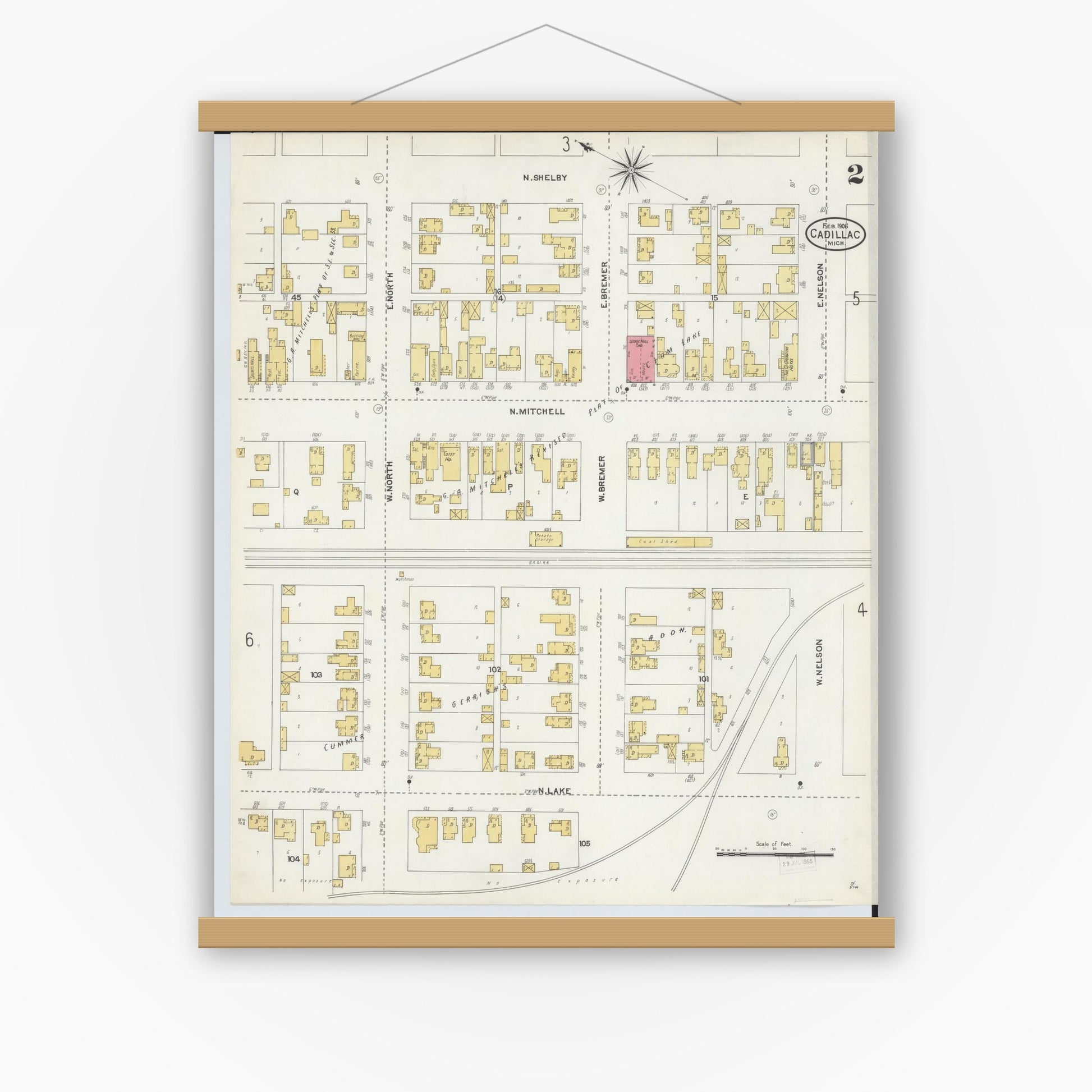 Old map wall art mockup — magnetic wood frame on white wall — Sanborn Fire Insurance Map from Cadillac, Wexford County, Michigan (1906), Sheet #0002