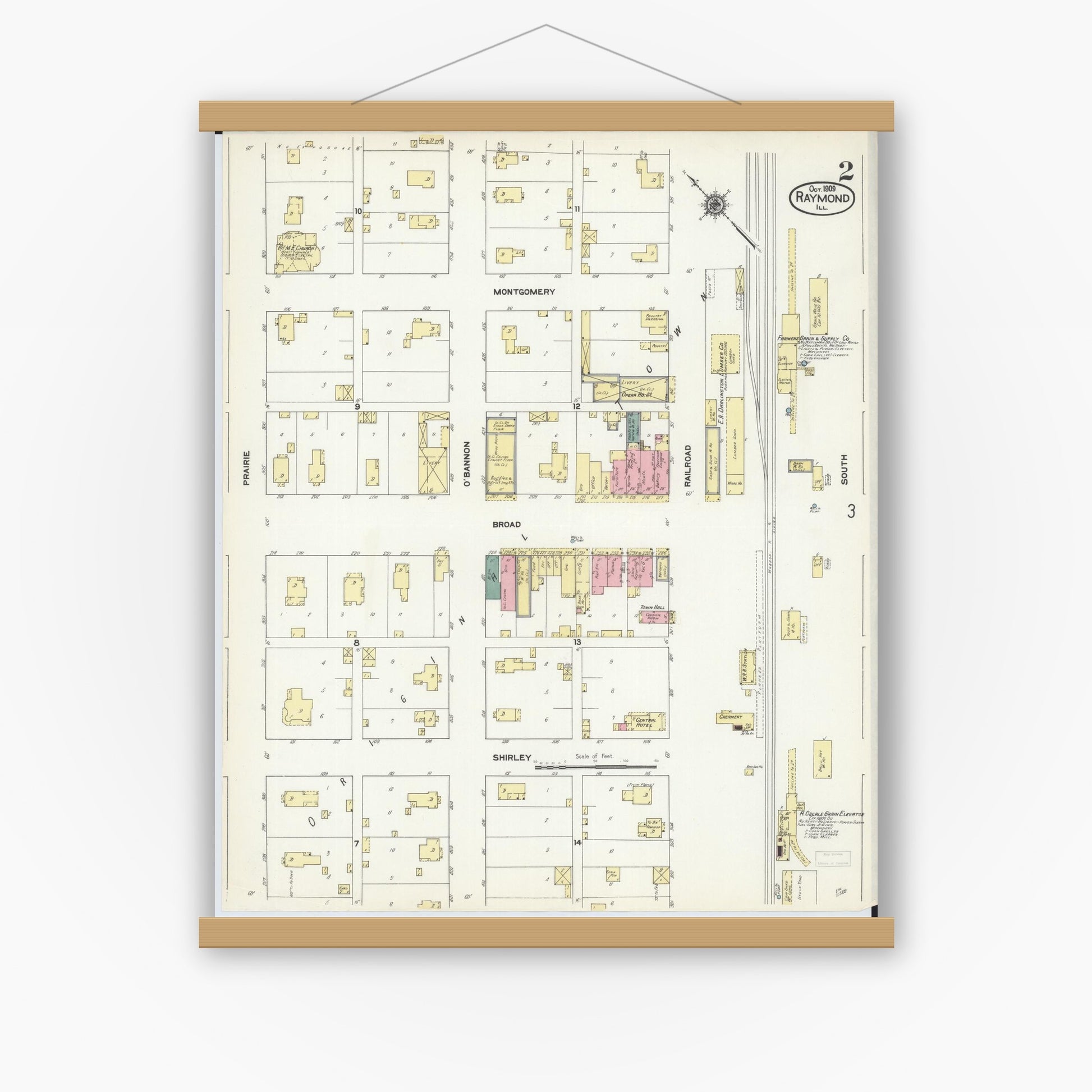 Old map wall art mockup — magnetic wood frame on white wall — Sanborn Fire Insurance Map from Raymond, Montgomery County, Illinois (1909), Sheet #0002