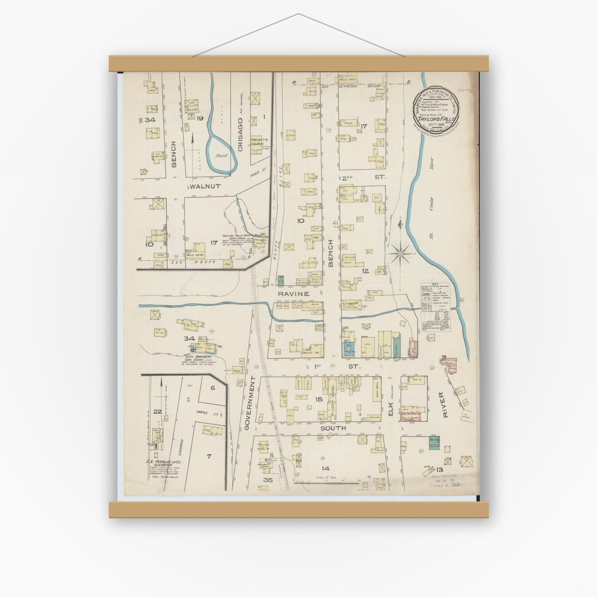 Old map wall art mockup — magnetic wood frame on white wall — Sanborn Fire Insurance Map from Taylors Falls, Chisago County, Minnesota (1885), Sheet #0001