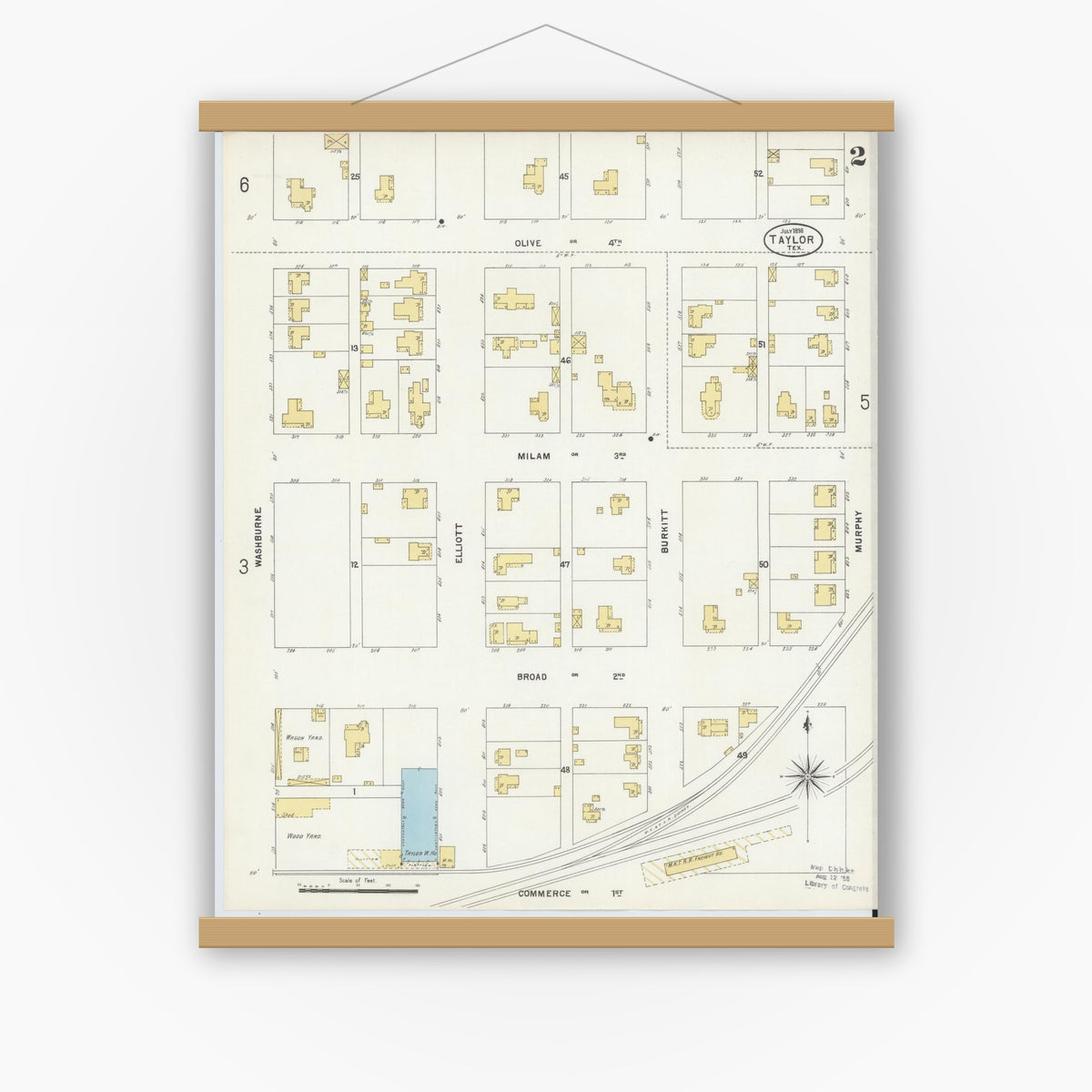Old map wall art mockup — magnetic wood frame on white wall — Sanborn Fire Insurance Map from Taylor, Williamson County, Texas (1898), Sheet #0002