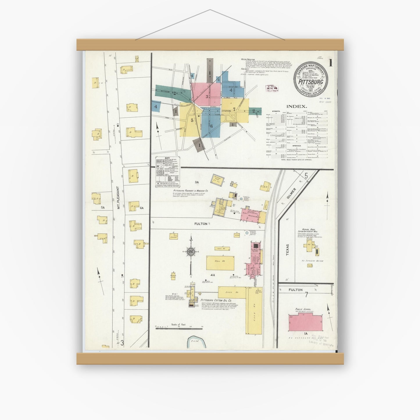 Old map wall art mockup — magnetic wood frame on white wall — Sanborn Fire Insurance Map from Pittsburg, Camp County, Texas (1911), Sheet #0001