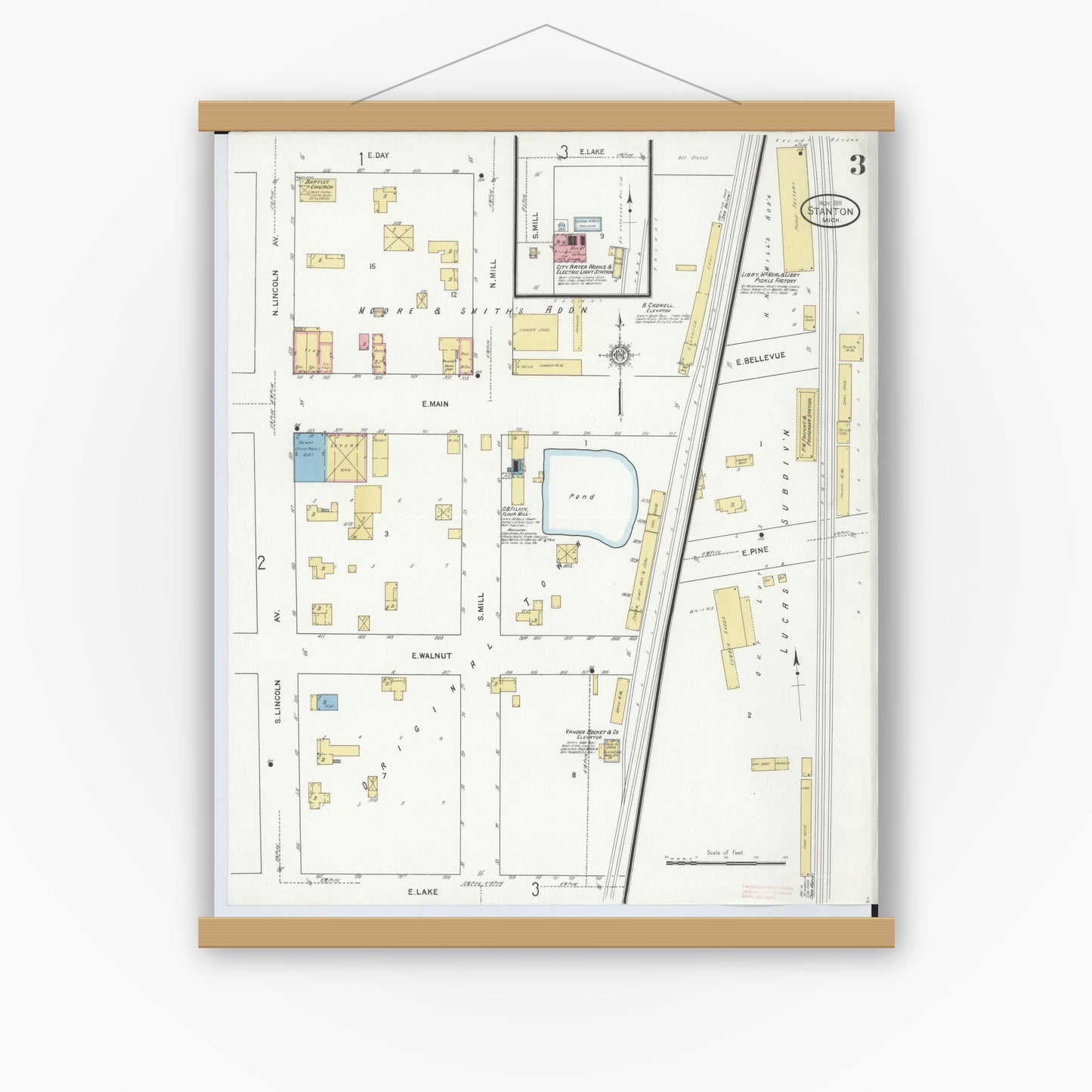 Old map wall art mockup — magnetic wood frame on white wall — Sanborn Fire Insurance Map from Stanton, Montcalm County, Michigan (1911), Sheet #0003
