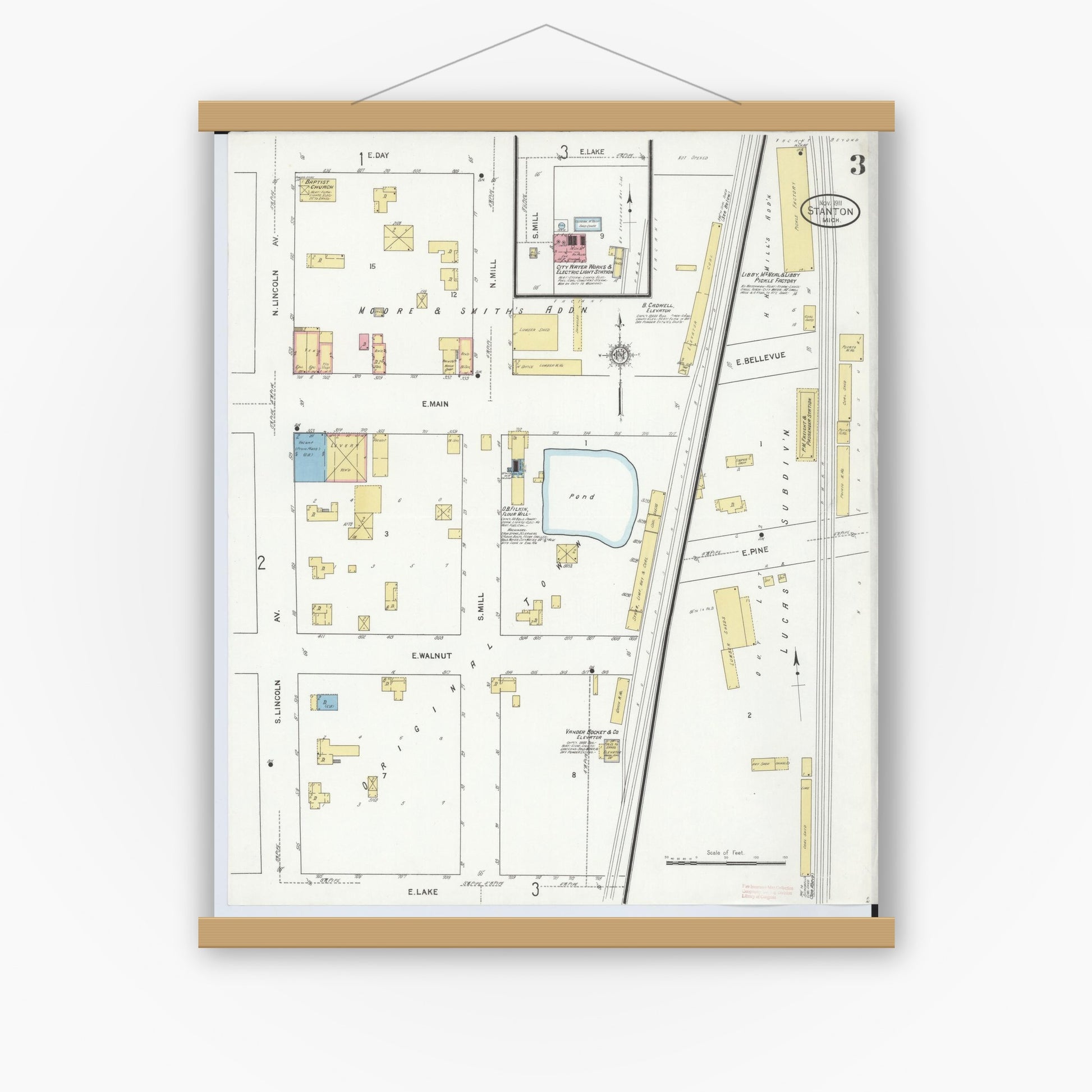 Old map wall art mockup — magnetic wood frame on white wall — Sanborn Fire Insurance Map from Stanton, Montcalm County, Michigan (1911), Sheet #0003