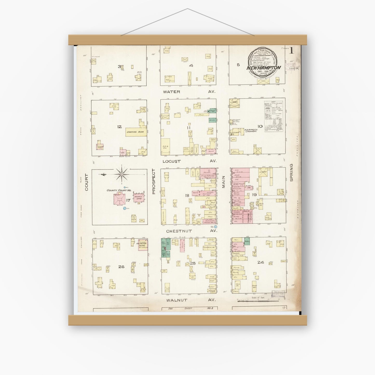 Old map wall art mockup — magnetic wood frame on white wall — Sanborn Fire Insurance Map from New Hampton, Chickasaw County, Iowa (1885) â€” Complete Set