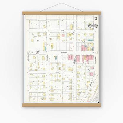 Old map wall art mockup — magnetic wood frame on white wall — Sanborn Fire Insurance Map from What Cheer, Keokuk County, Iowa (1893), Sheet #0002