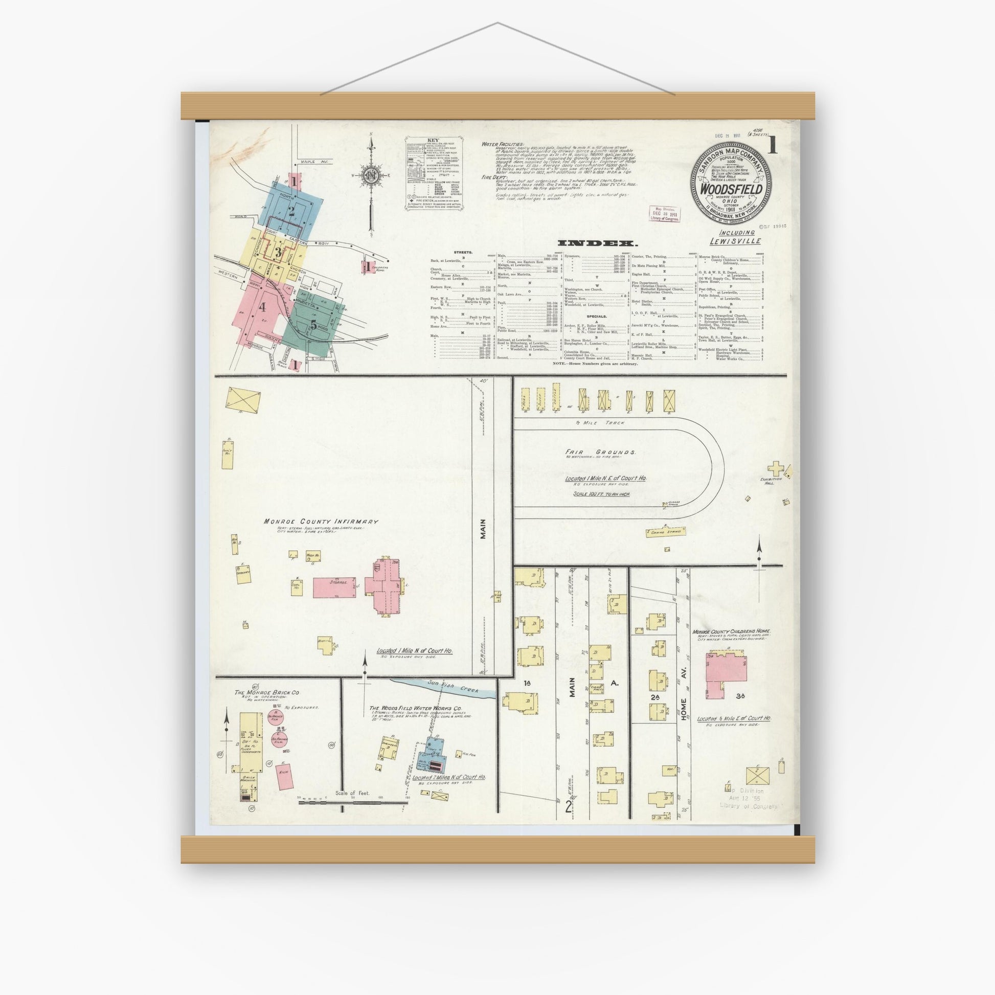 Old map wall art mockup — magnetic wood frame on white wall — Sanborn Fire Insurance Map from Woodsfield, Monroe County, Ohio (1911), Sheet #0001