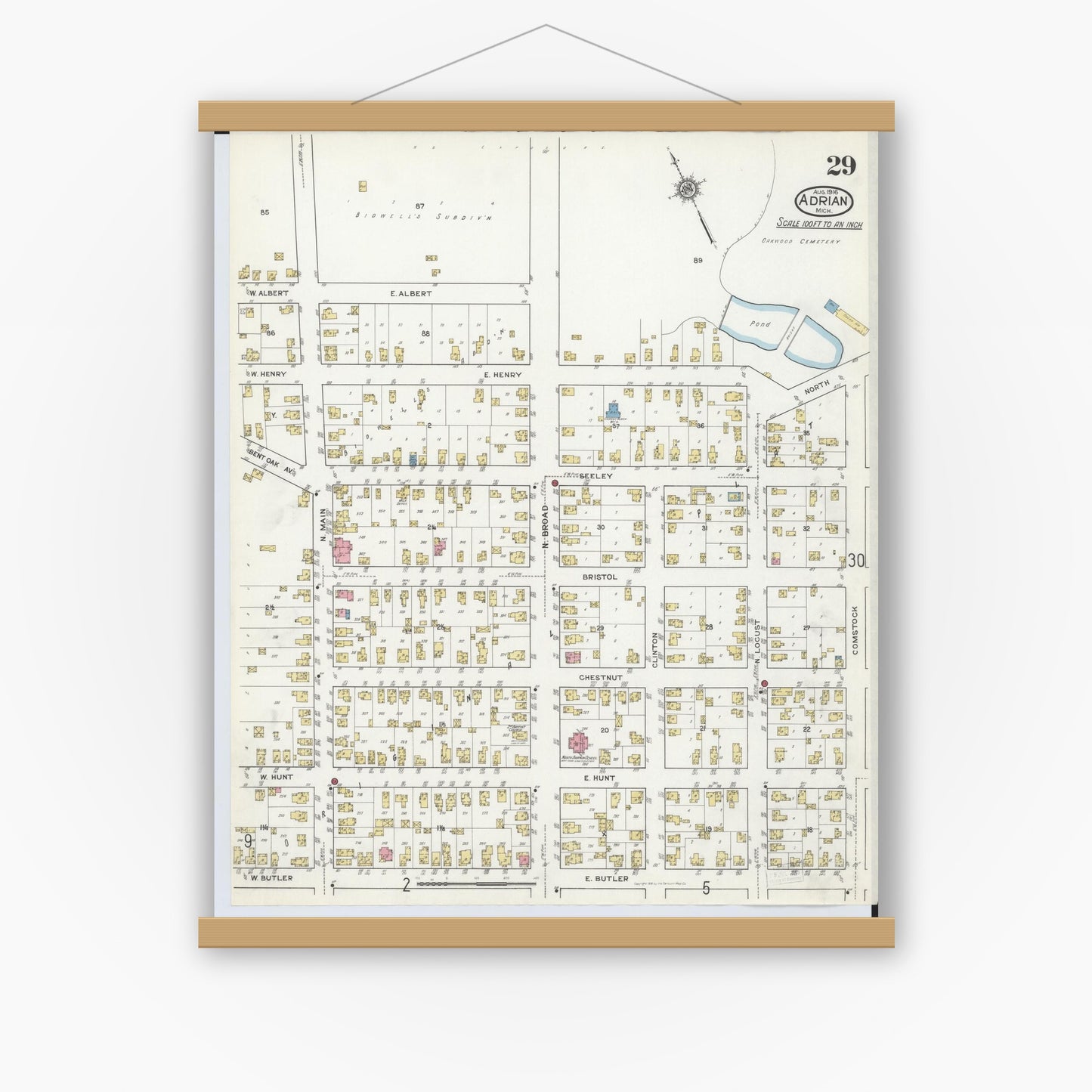 Old map wall art mockup — magnetic wood frame on white wall — Sanborn Fire Insurance Map from Adrian, Lenawee County, Michigan (1916), Sheet #0029
