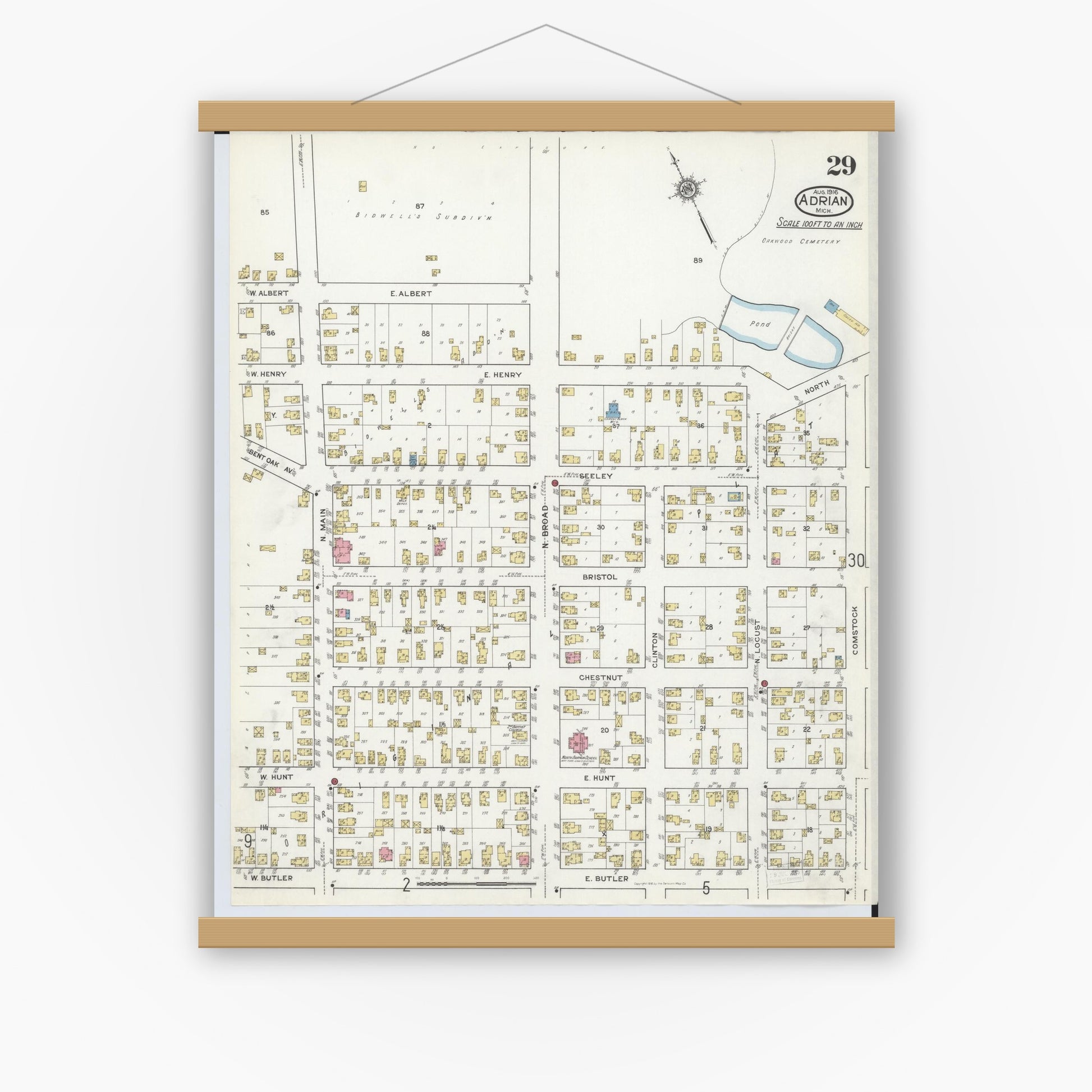Old map wall art mockup — magnetic wood frame on white wall — Sanborn Fire Insurance Map from Adrian, Lenawee County, Michigan (1916), Sheet #0029