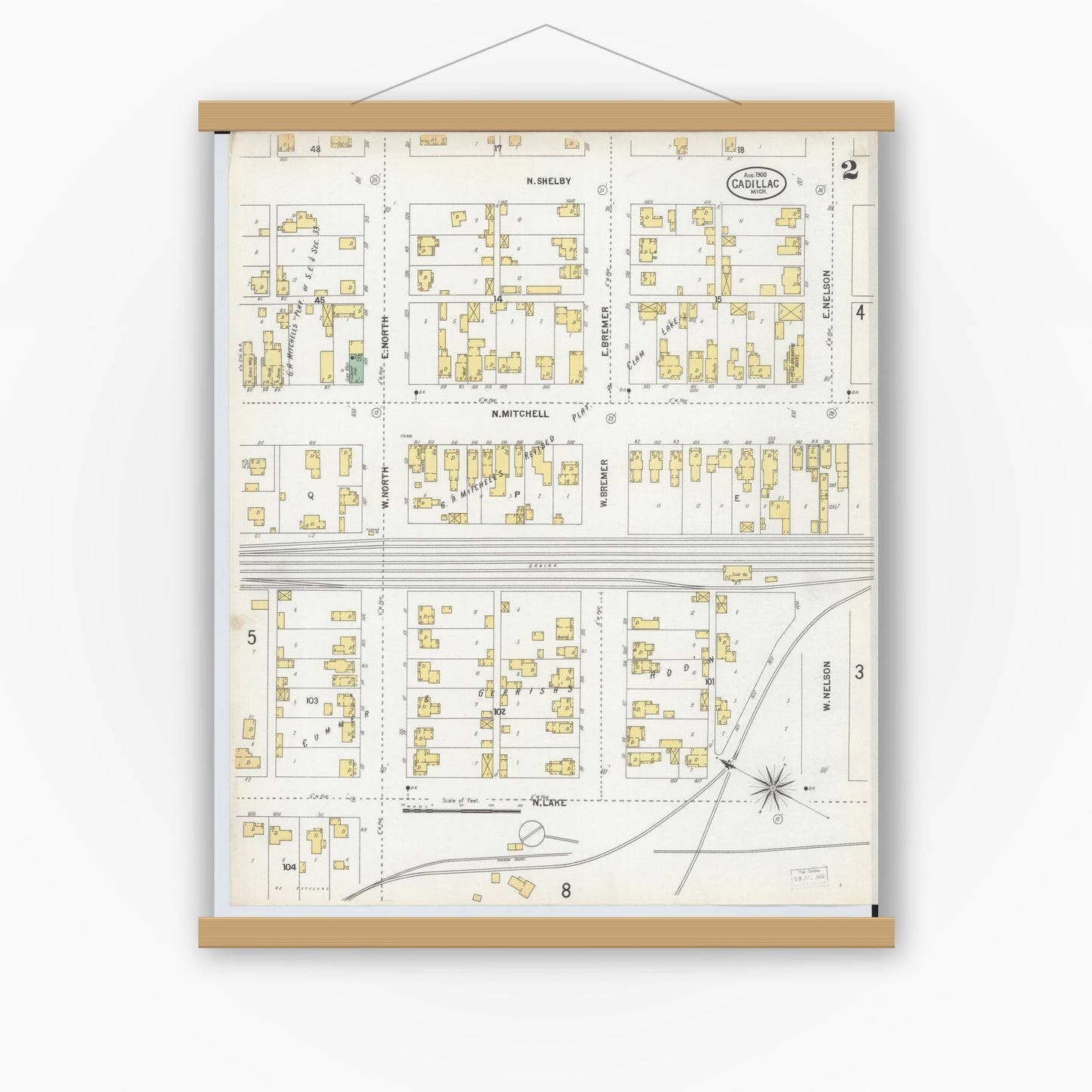 Old map wall art mockup — magnetic wood frame on white wall — Sanborn Fire Insurance Map from Cadillac, Wexford County, Michigan (1900), Sheet #0002