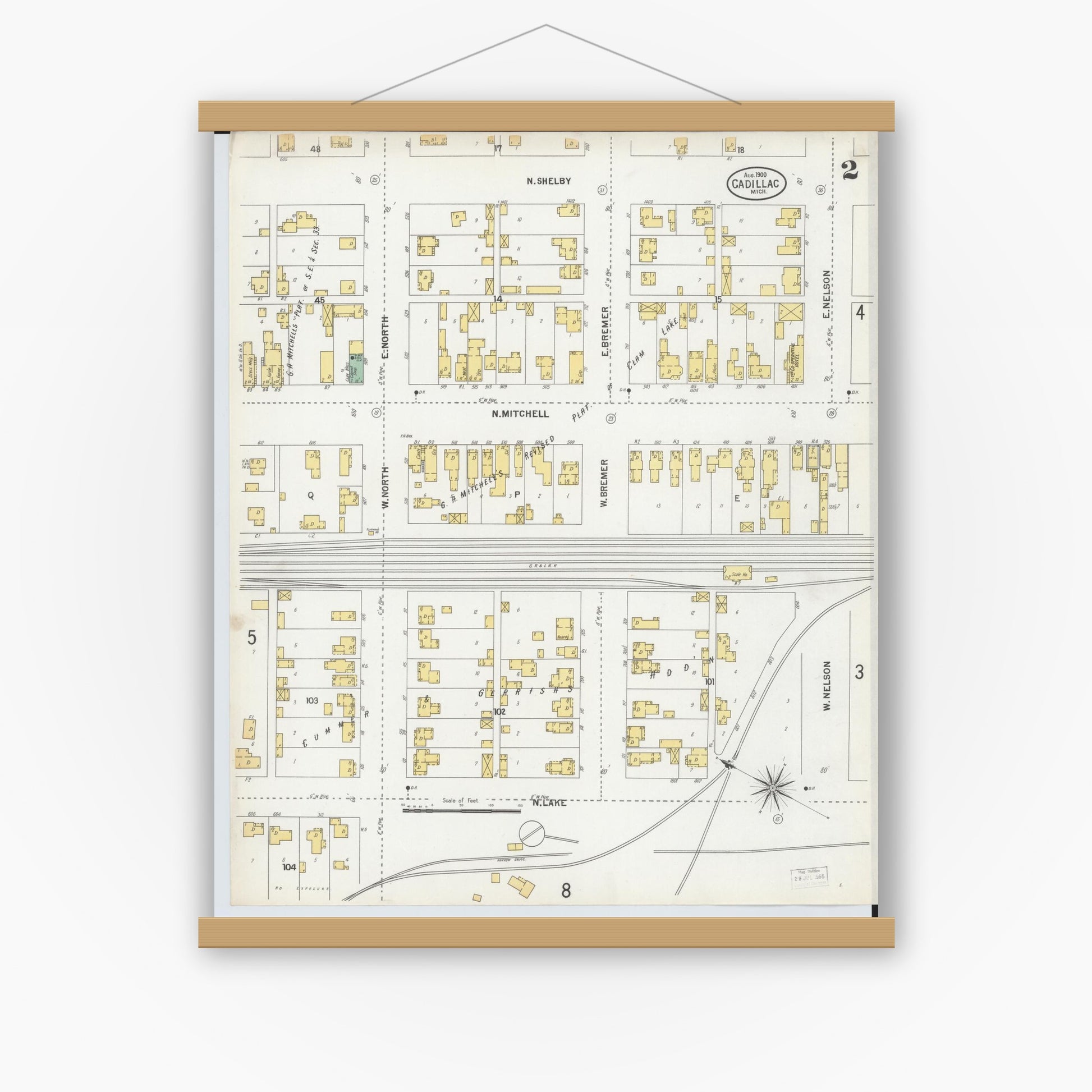 Old map wall art mockup — magnetic wood frame on white wall — Sanborn Fire Insurance Map from Cadillac, Wexford County, Michigan (1900), Sheet #0002