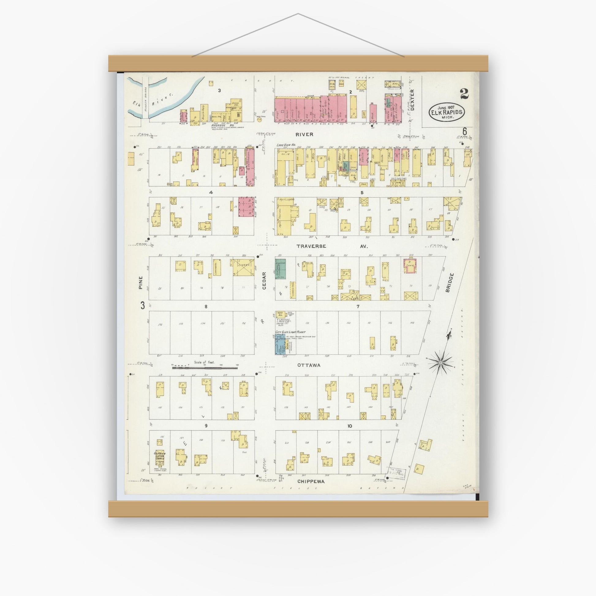 Old map wall art mockup — magnetic wood frame on white wall — Sanborn Fire Insurance Map from Elk Rapids, Antrim County, Michigan (1907), Sheet #0002