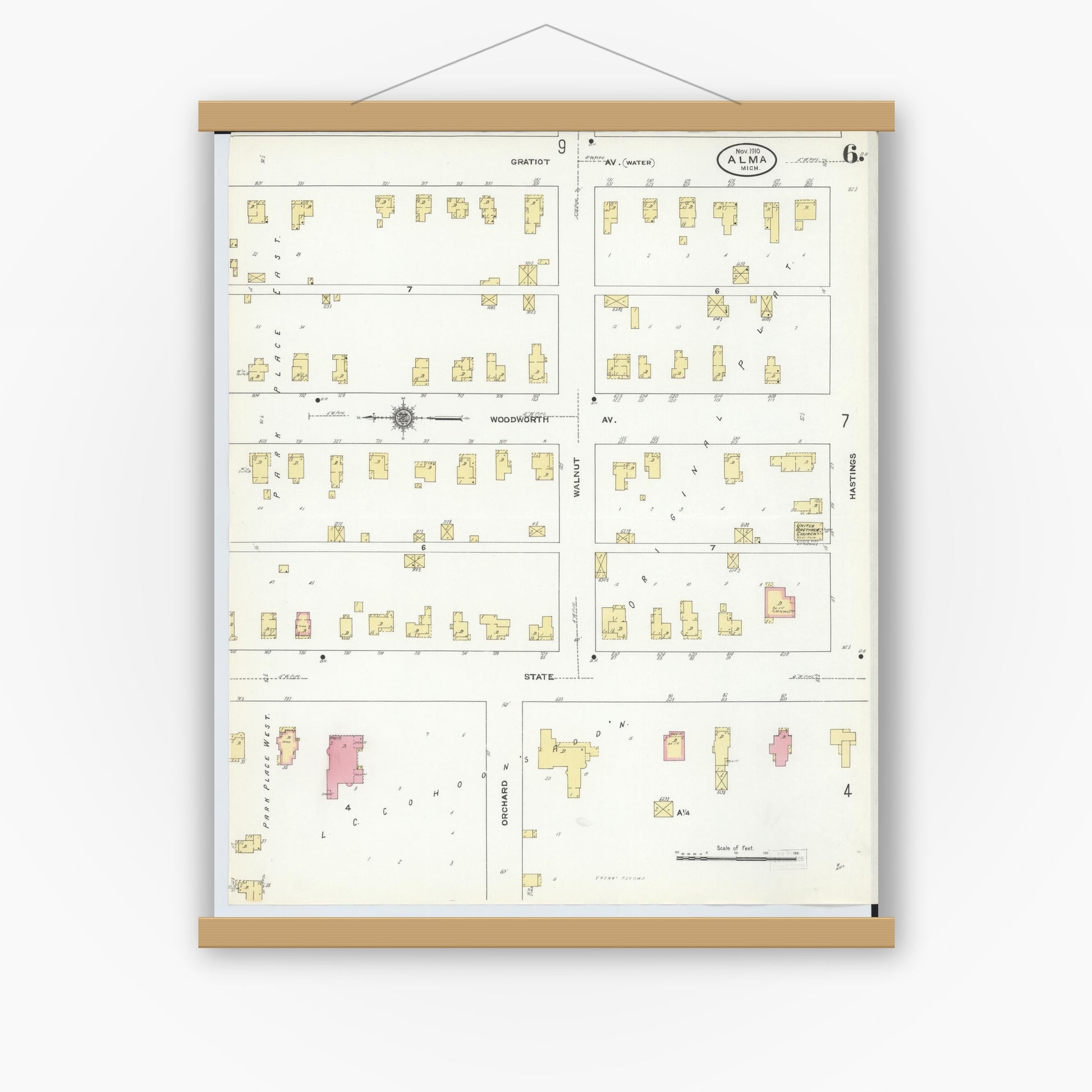 Old map wall art mockup — magnetic wood frame on white wall — Sanborn Fire Insurance Map from Alma, Gratiot County, Michigan (1910), Sheet #0006