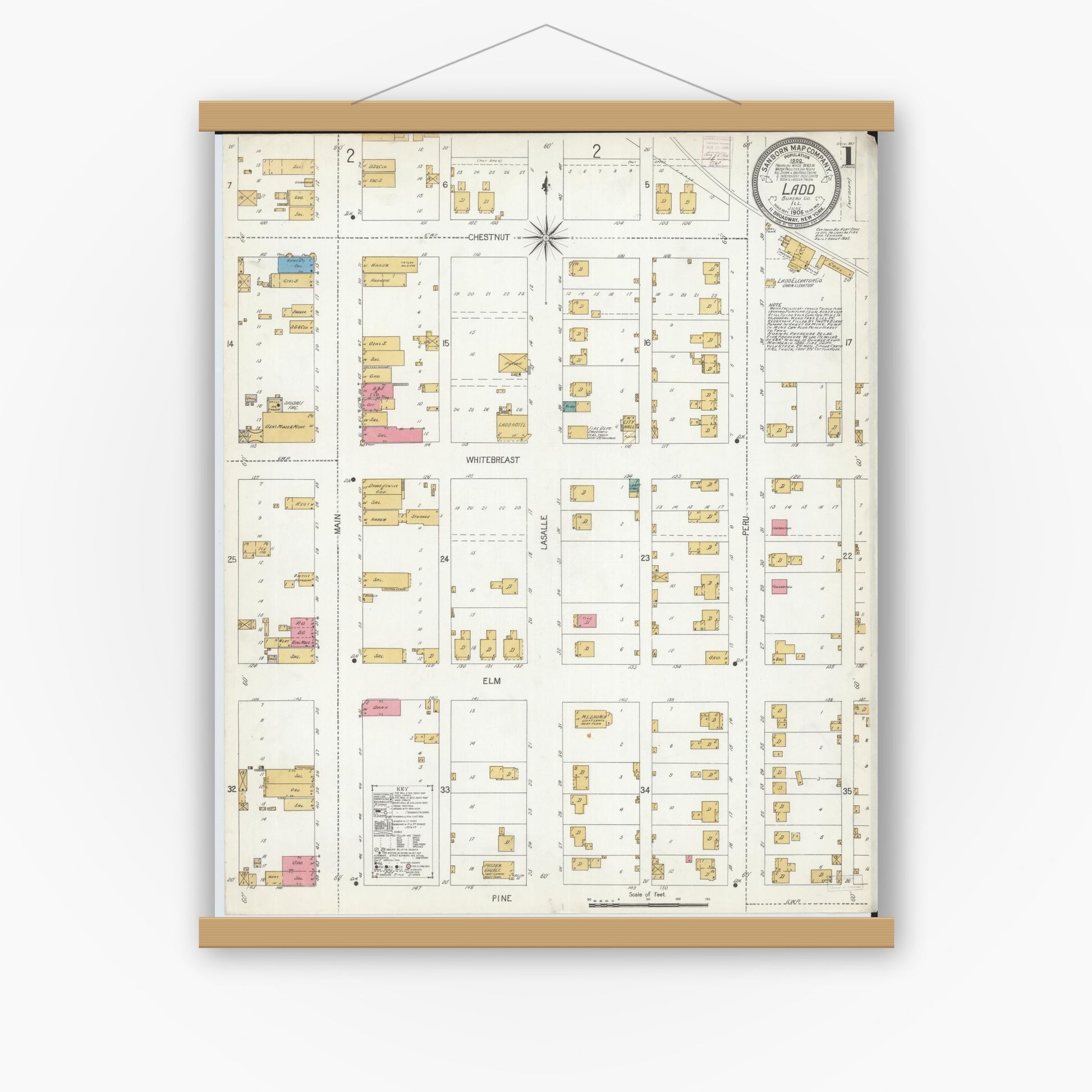 Old map wall art mockup — magnetic wood frame on white wall — Sanborn Fire Insurance Map from Ladd, Bureau County, Illinois (1906), Sheet #0001