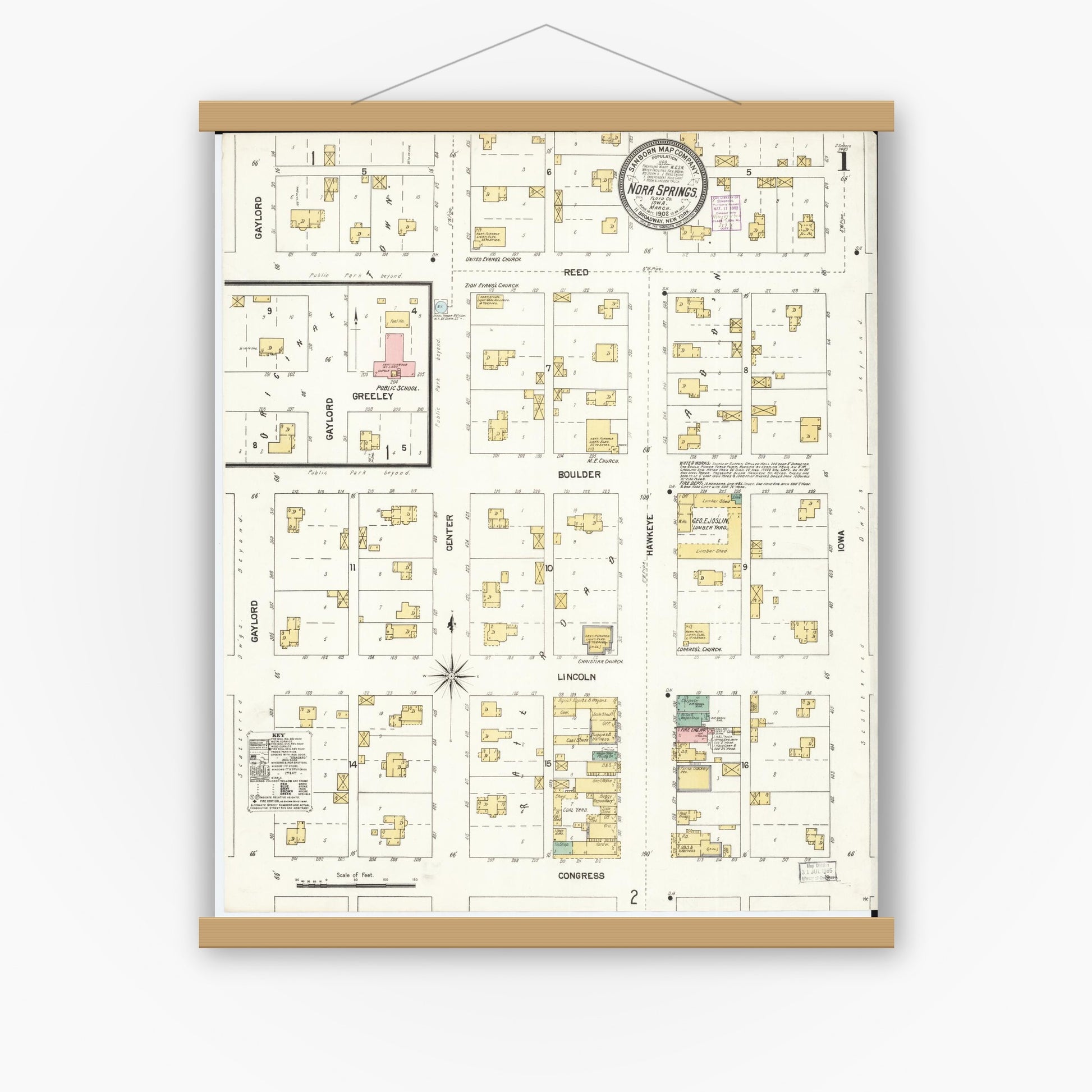 Old map wall art mockup — magnetic wood frame on white wall — Sanborn Fire Insurance Map from Nora Springs, Floyd County, Iowa (1902) â€” Complete Set