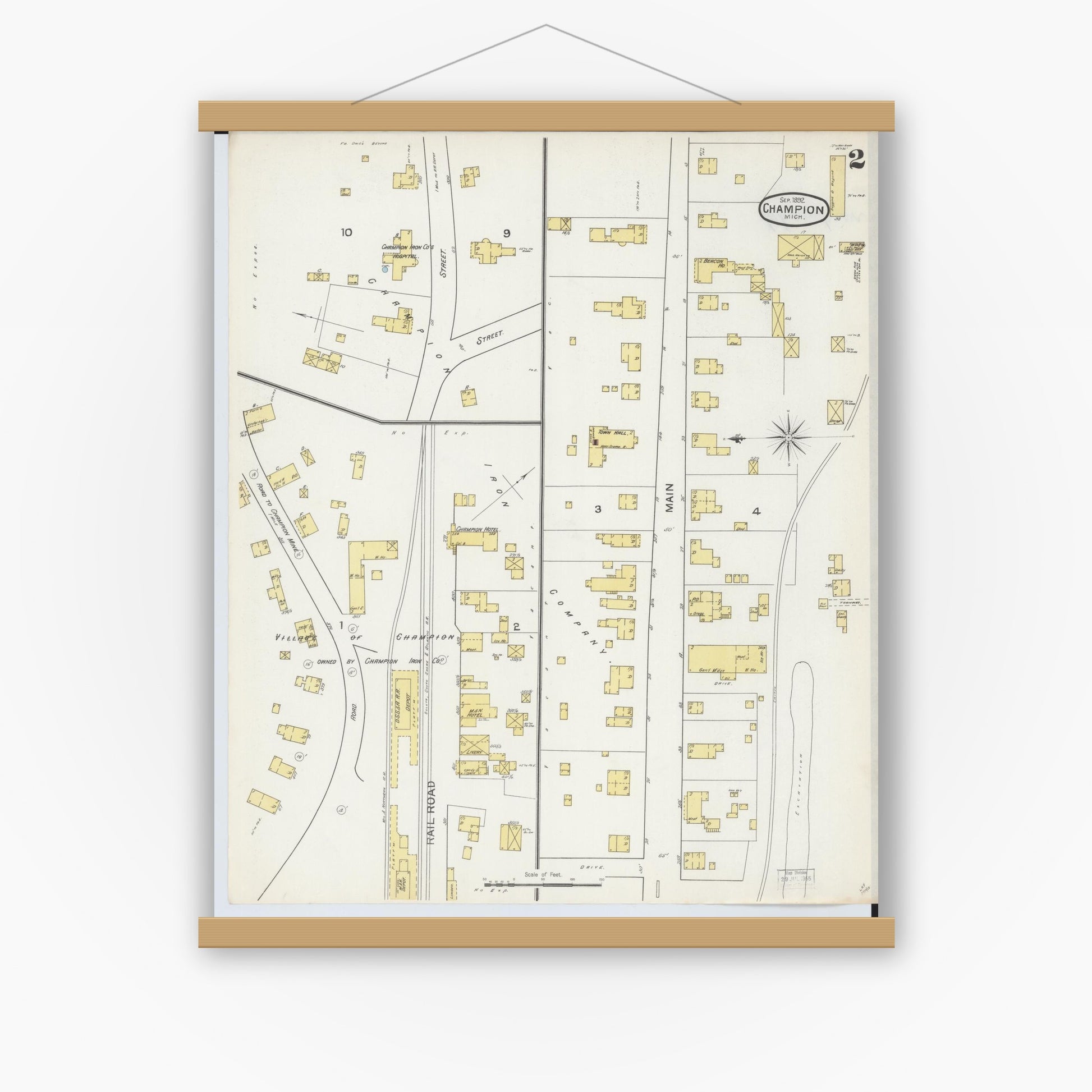 Old map wall art mockup — magnetic wood frame on white wall — Sanborn Fire Insurance Map from Champion, Marquette County, Michigan (1892), Sheet #0002