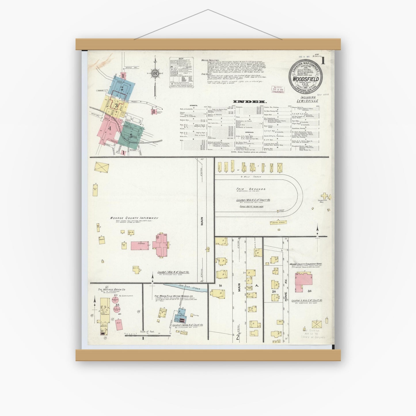 Old map wall art mockup — magnetic wood frame on white wall — Sanborn Fire Insurance Map from Woodsfield, Monroe County, Ohio (1911) - Complete Map Set