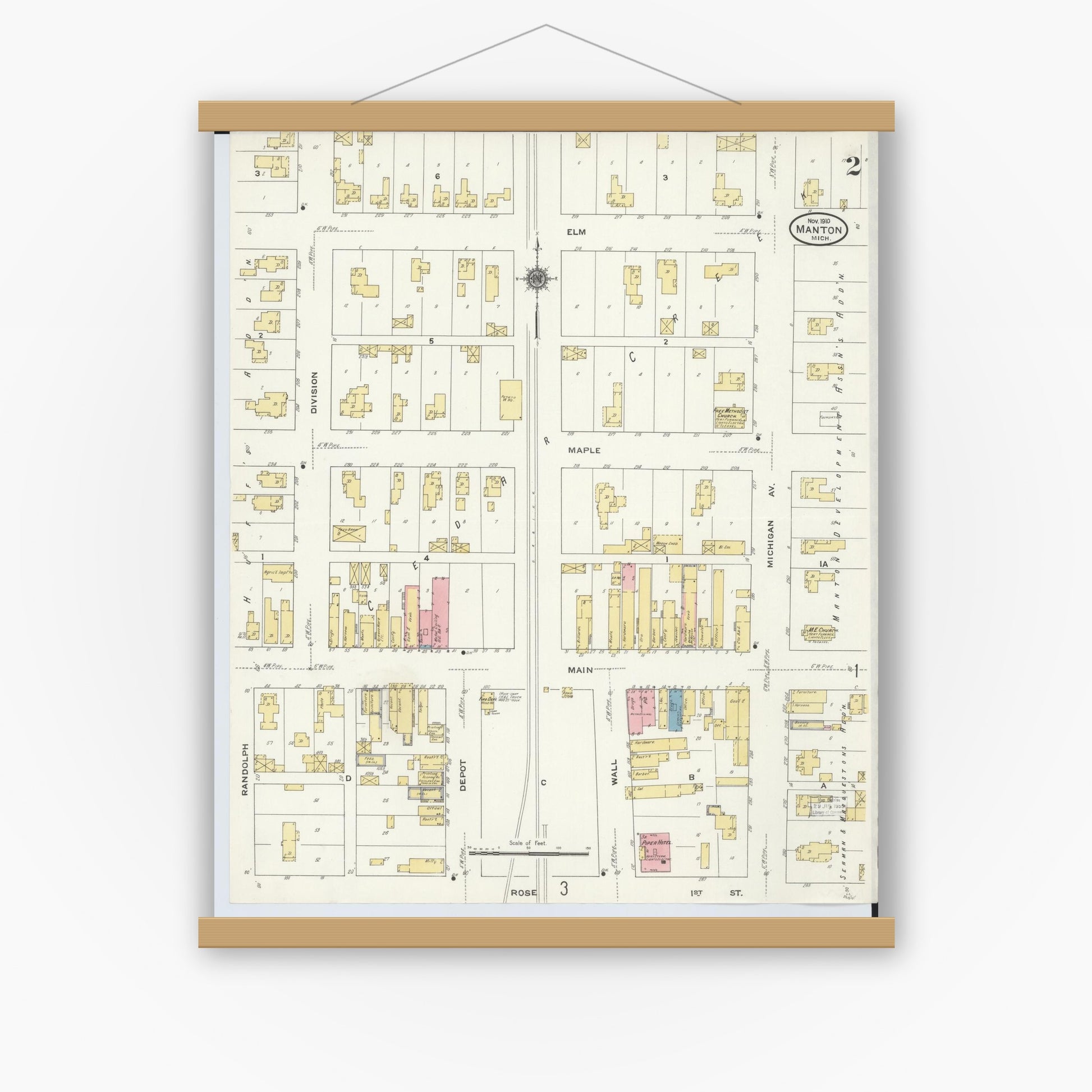 Old map wall art mockup — magnetic wood frame on white wall — Sanborn Fire Insurance Map from Manton, Wexford County, Michigan (1910), Sheet #0002