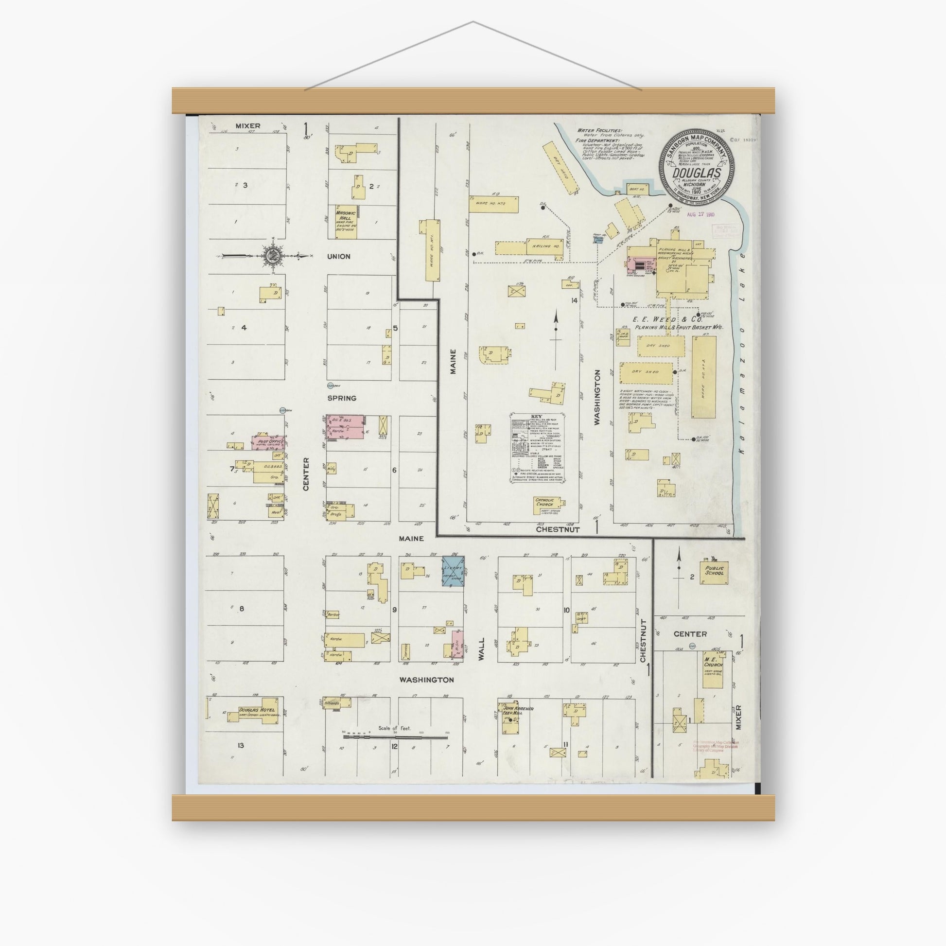 Old map wall art mockup — magnetic wood frame on white wall — Sanborn Fire Insurance Map from Douglas, Allegan County, Michigan (1910), Sheet #0001