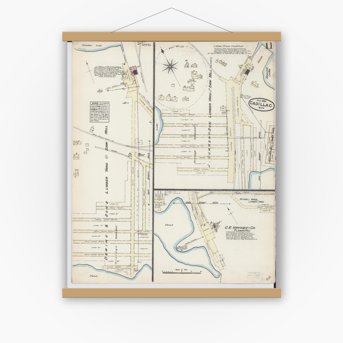 Old map wall art mockup — magnetic wood frame on white wall — Sanborn Fire Insurance Map from Cadillac, Wexford County, Michigan (1884), Sheet #0011