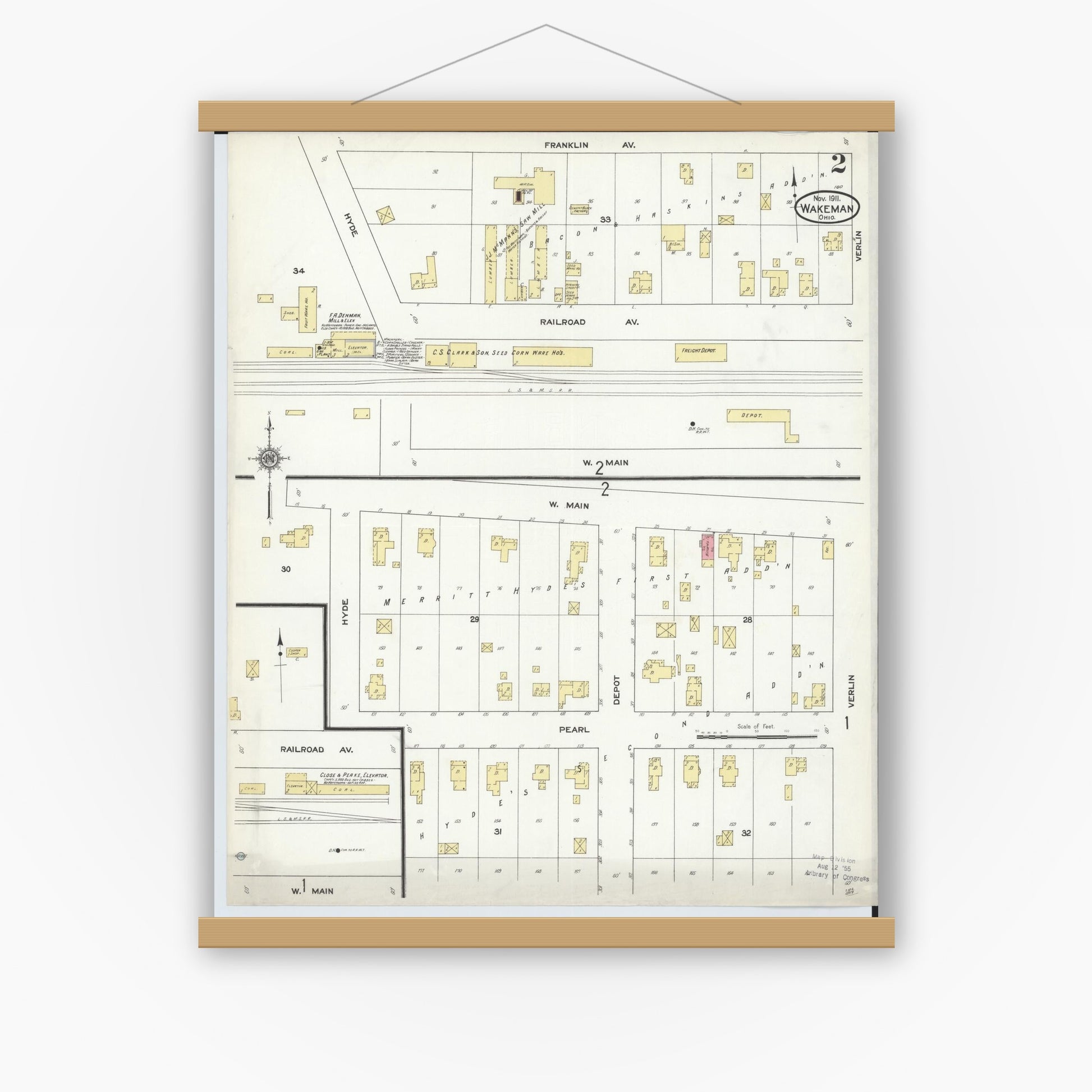 Old map wall art mockup — magnetic wood frame on white wall — Sanborn Fire Insurance Map from Wakeman, Huron County, Ohio (1911), Sheet #0002