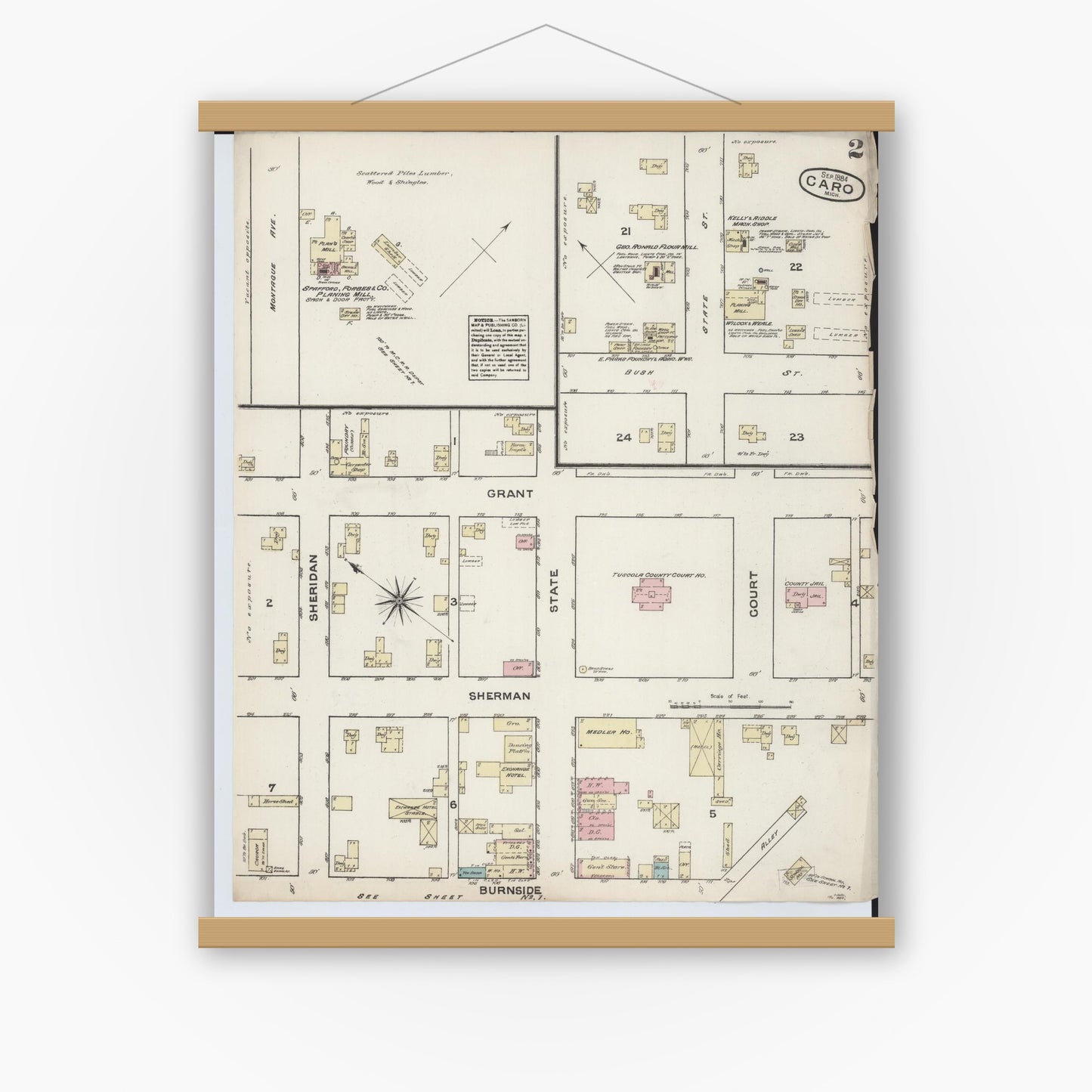 Old map wall art mockup — magnetic wood frame on white wall — Sanborn Fire Insurance Map from Caro, Tuscola County, Michigan (1884), Sheet #0002