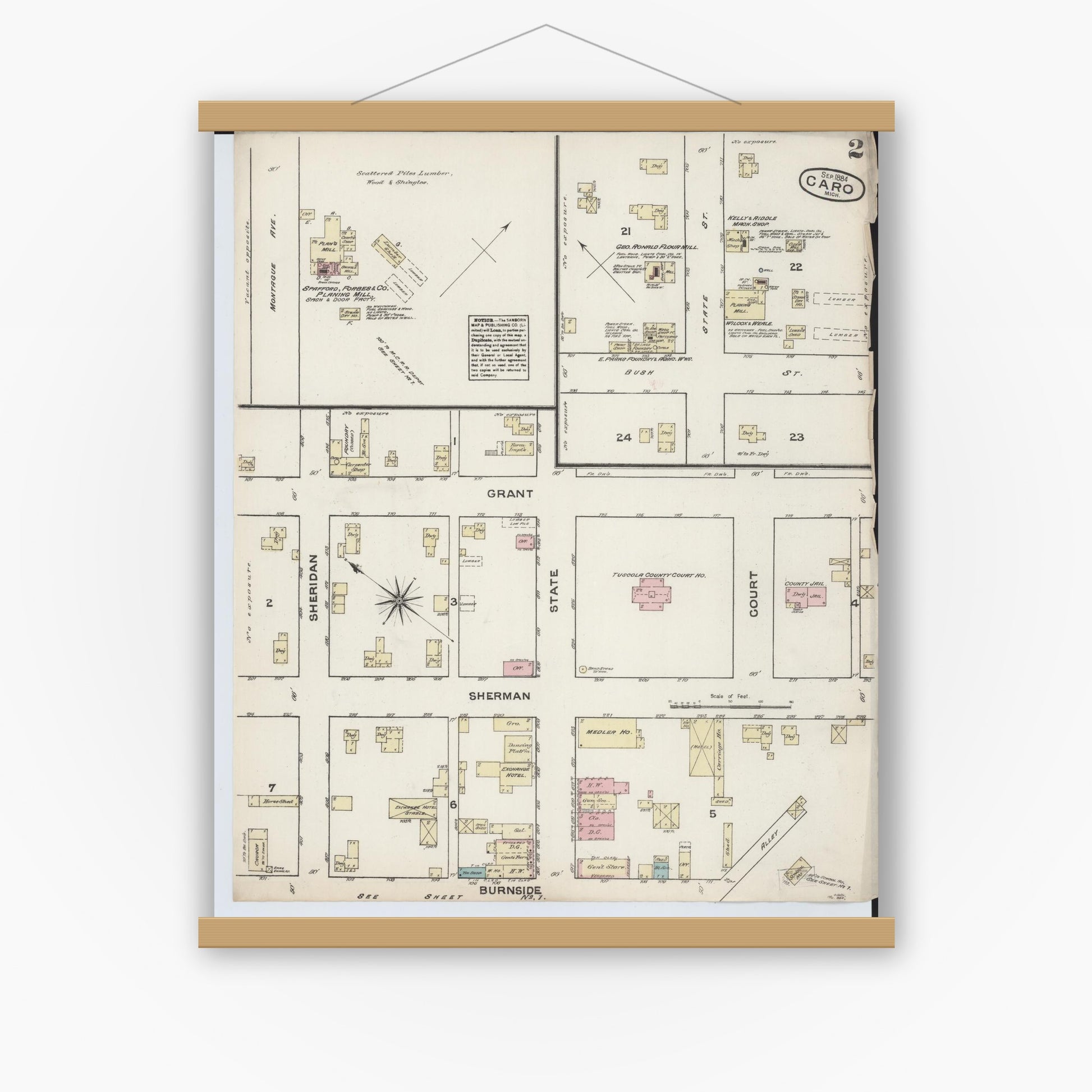 Old map wall art mockup — magnetic wood frame on white wall — Sanborn Fire Insurance Map from Caro, Tuscola County, Michigan (1884), Sheet #0002