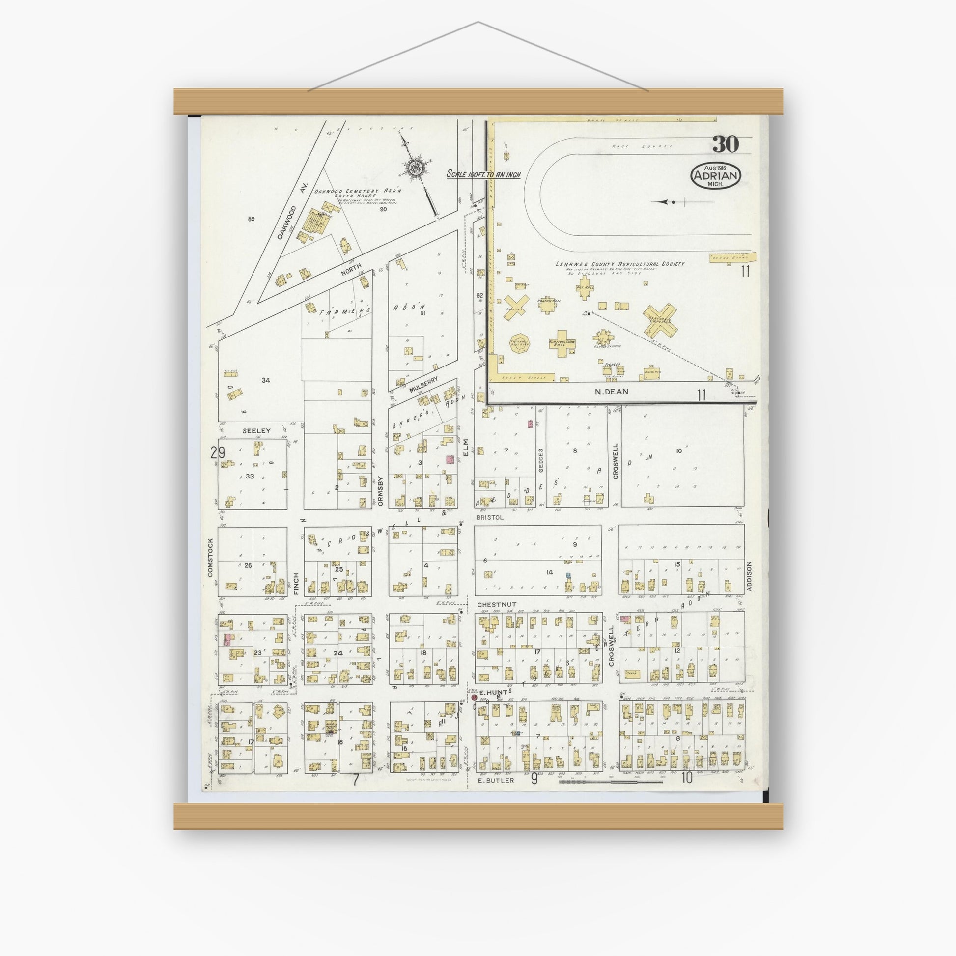 Old map wall art mockup — magnetic wood frame on white wall — Sanborn Fire Insurance Map from Adrian, Lenawee County, Michigan (1916), Sheet #0030