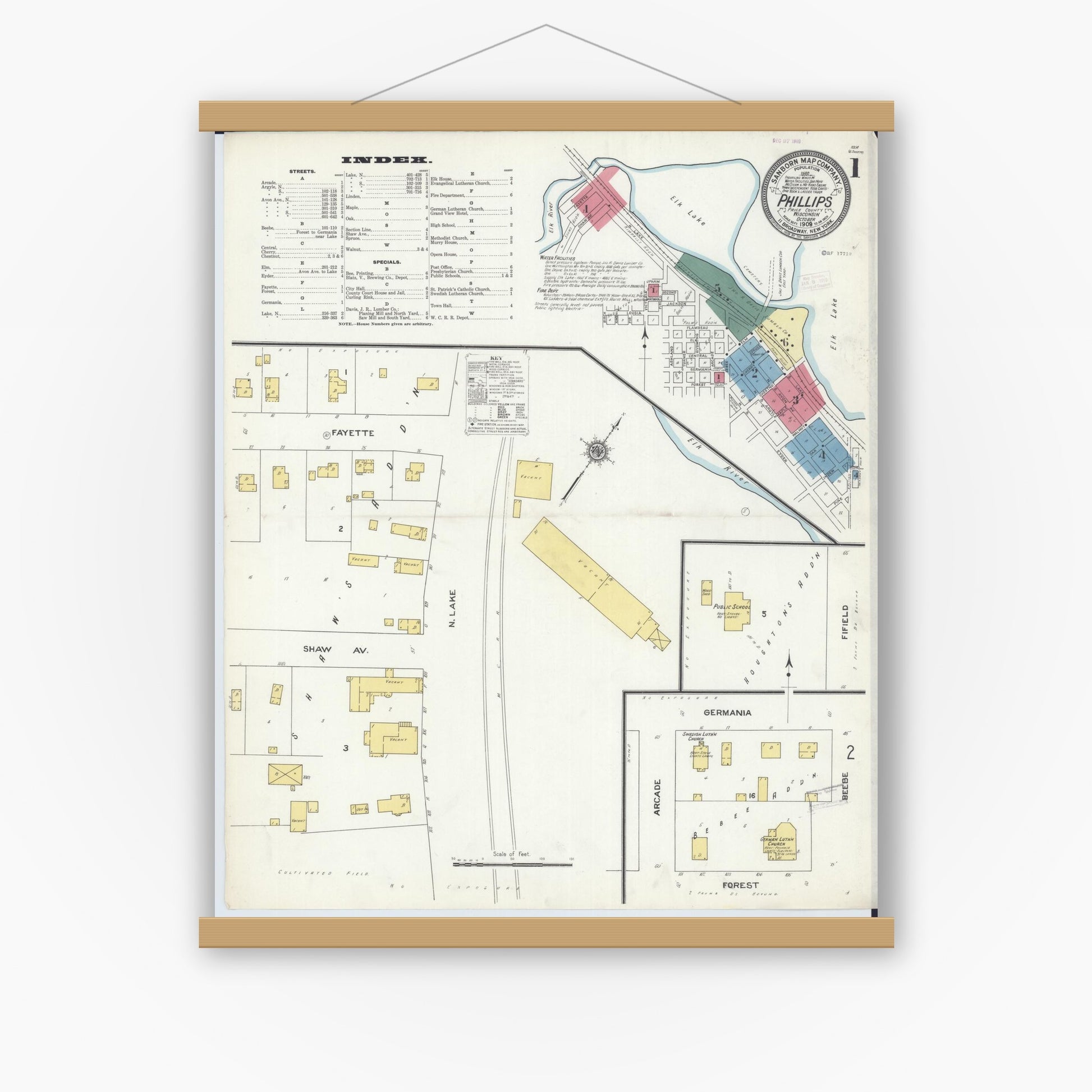 Old map wall art mockup — magnetic wood frame on white wall — Sanborn Fire Insurance Map from Phillips, Price County, Wisconsin (1909), Sheet #0001
