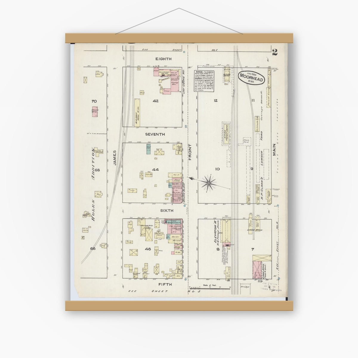 Old map wall art mockup — magnetic wood frame on white wall — Sanborn Fire Insurance Map from Moorhead, Clay County, Minnesota (1884), Sheet #0002