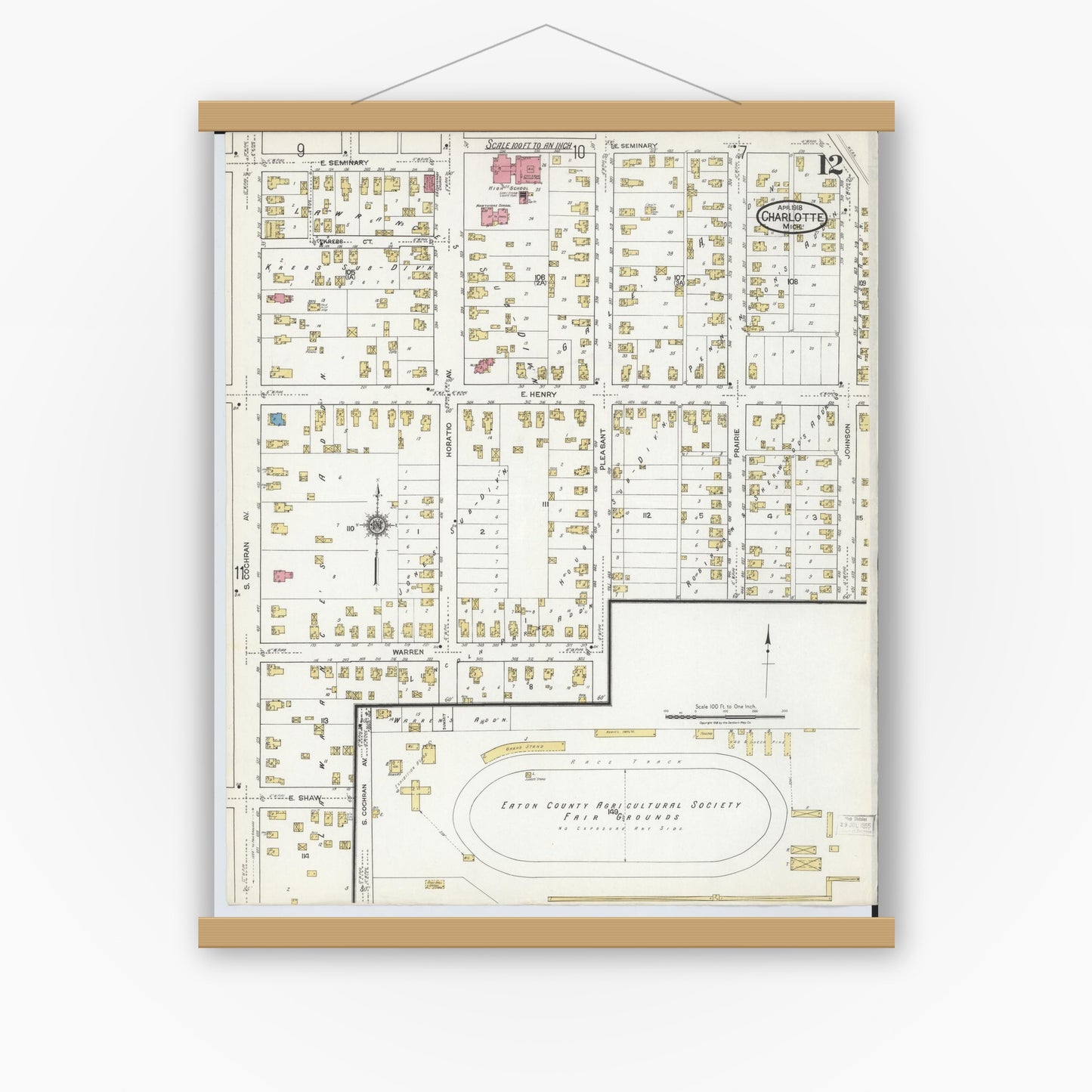 Old map wall art mockup — magnetic wood frame on white wall — Sanborn Fire Insurance Map from Charlotte, Eaton County, Michigan (1918), Sheet #0012