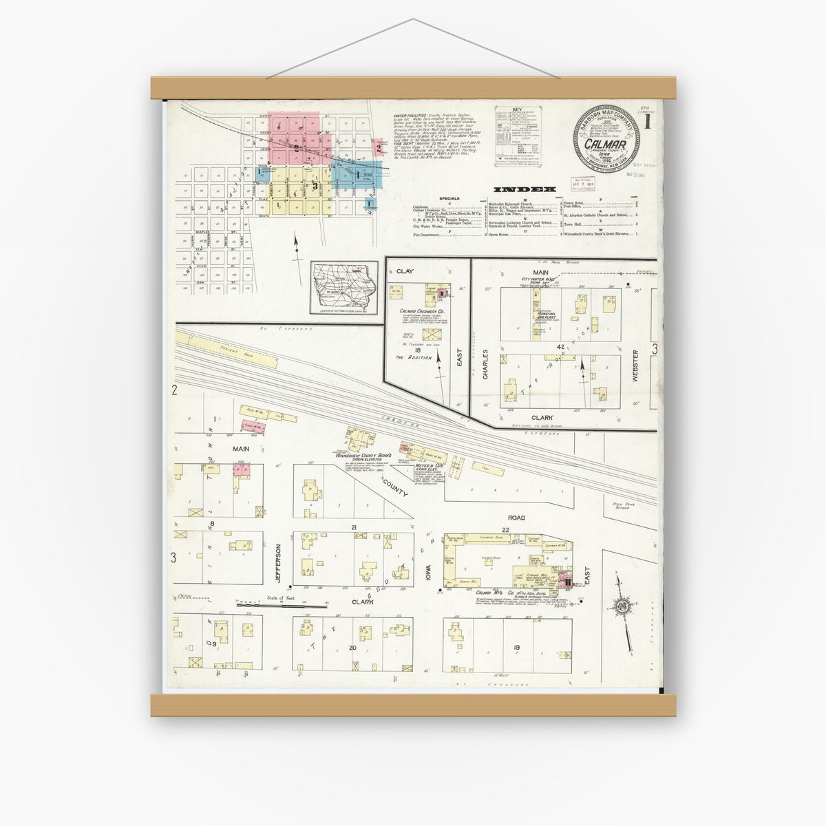 Old map wall art mockup — magnetic wood frame on white wall — Sanborn Fire Insurance Map from Calmar, Winneshiek County, Iowa (1914) â€” Complete Set