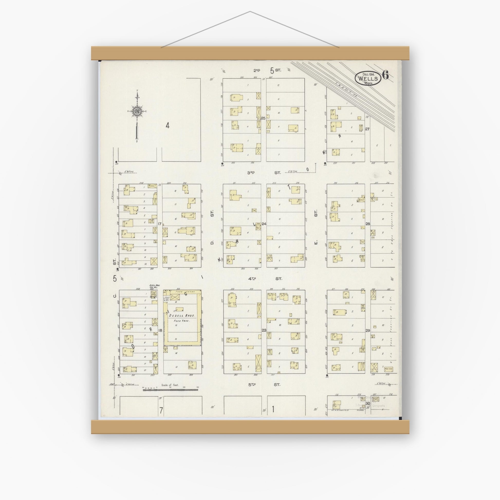 Old map wall art mockup — magnetic wood frame on white wall — Sanborn Fire Insurance Map from Wells, Faribault County, Minnesota (1914), Sheet #0006