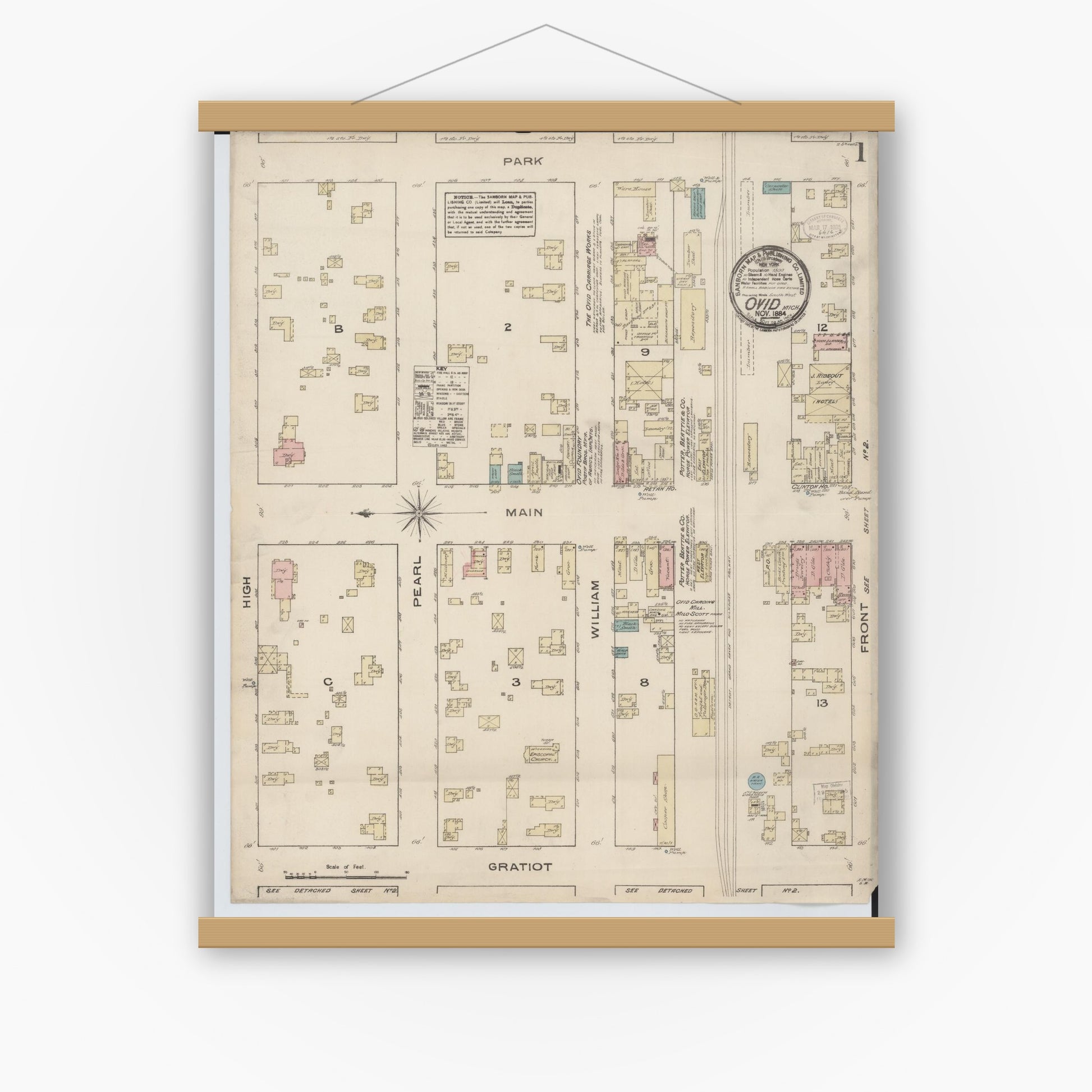 Old map wall art mockup — magnetic wood frame on white wall — Sanborn Fire Insurance Map from Ovid, Clinton County, Michigan (1884) - Complete Map Set