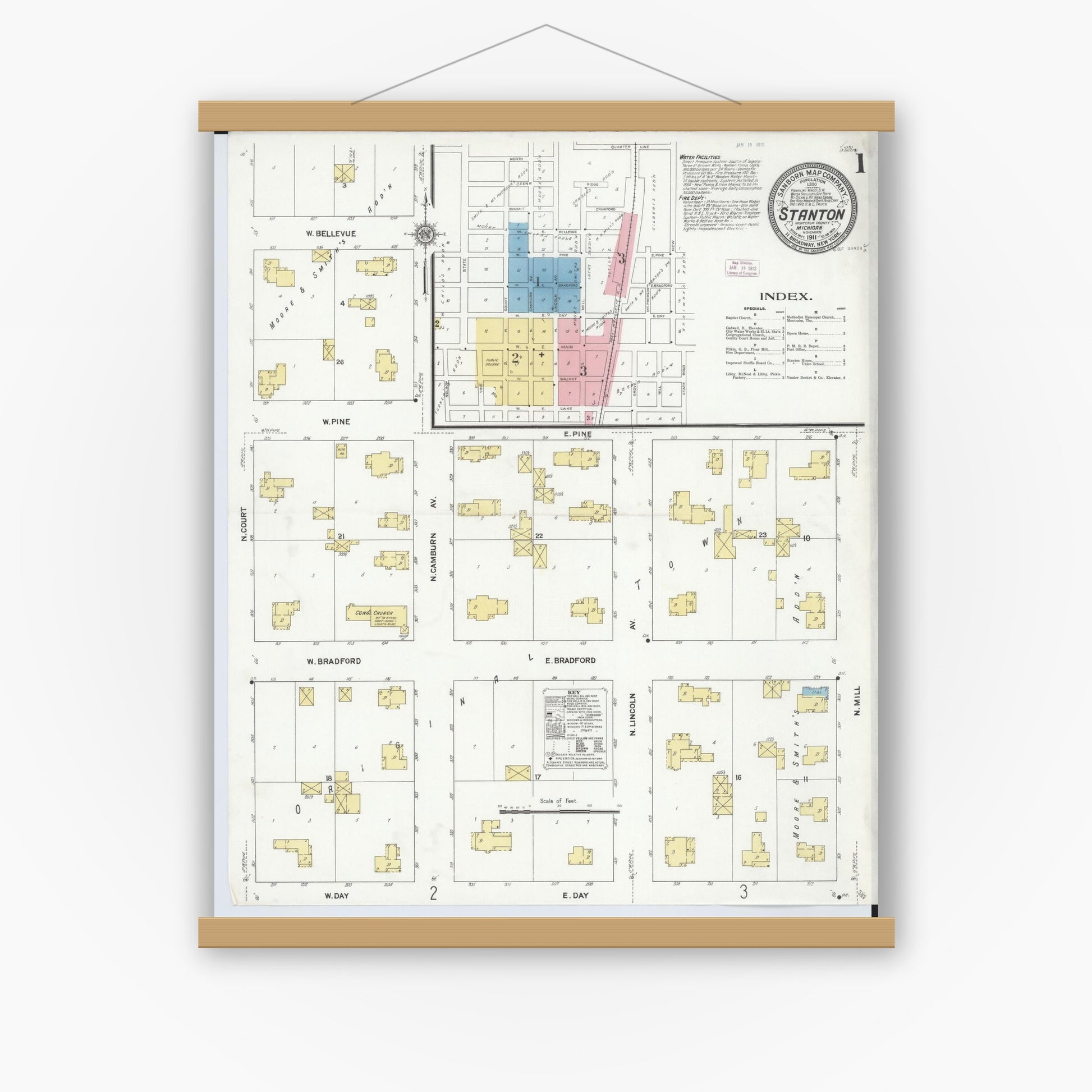 Old map wall art mockup — magnetic wood frame on white wall — Sanborn Fire Insurance Map from Stanton, Montcalm County, Michigan (1911) - Complete Map Set